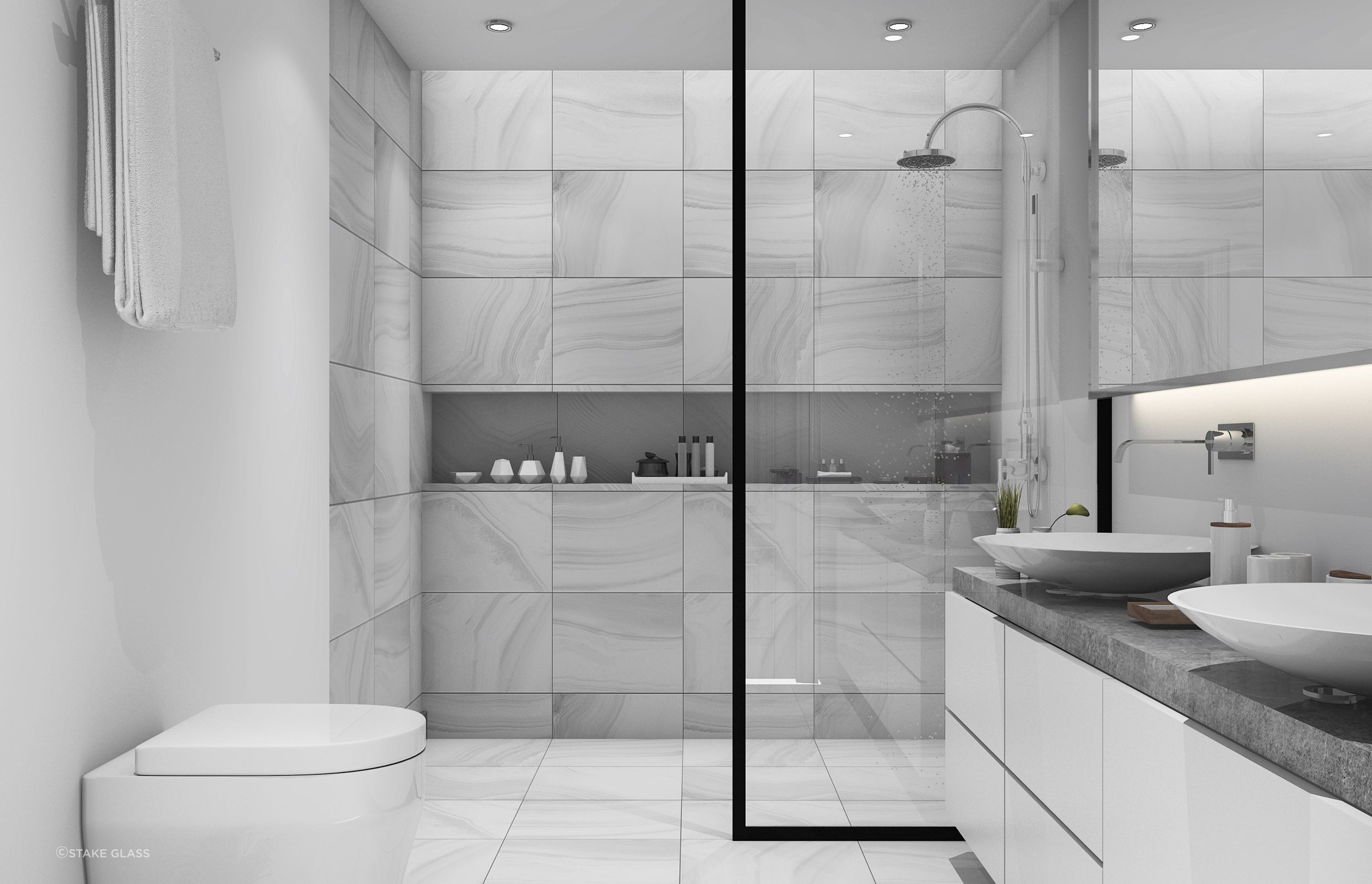 A walk-in shower allows you to seamlessly move into your shower, seen here and complemented by a quality glass panel by Stake Glass.