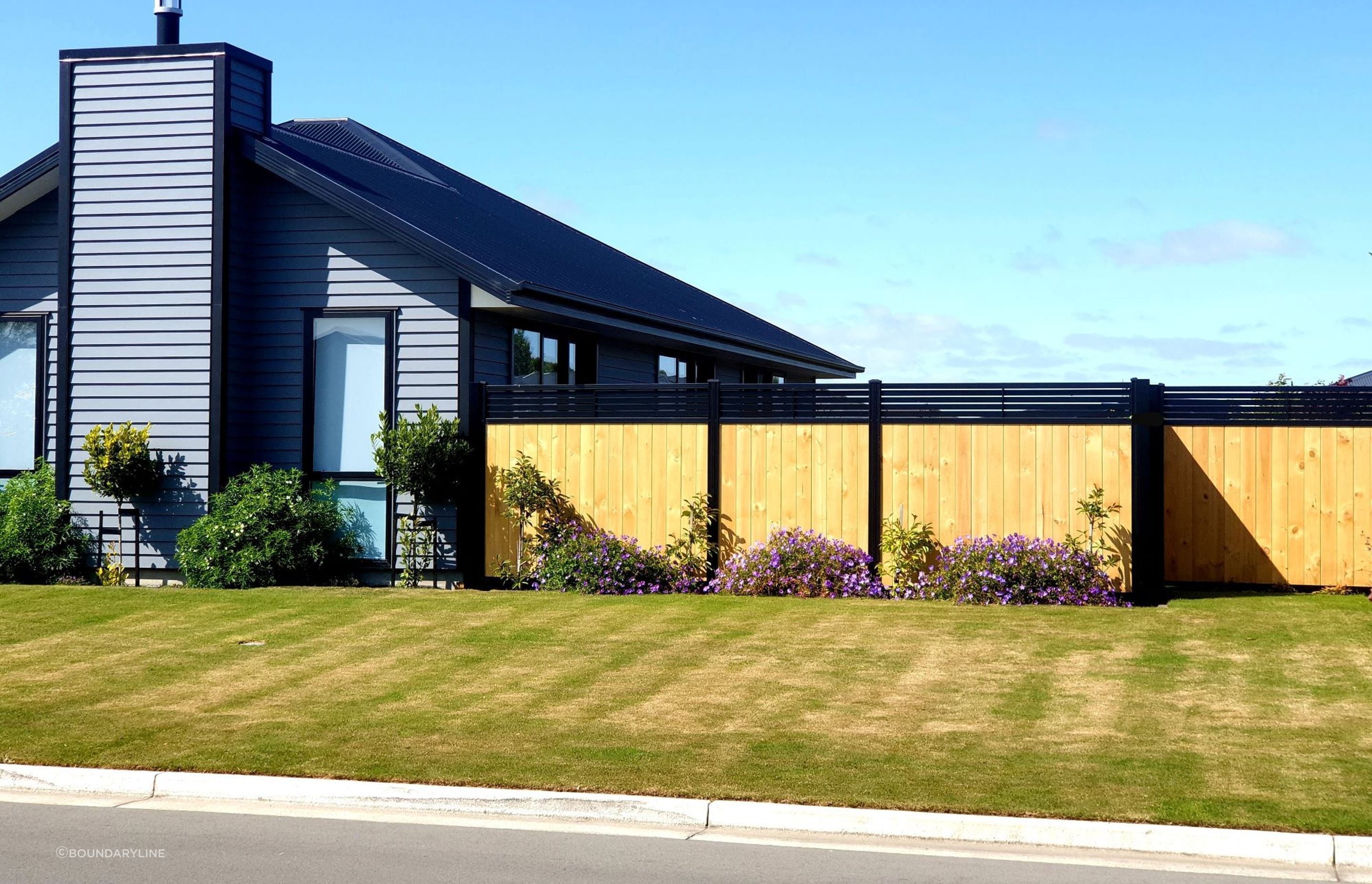 The stylish version of the classic wood fence with the SmartWall Slat-top fence.
