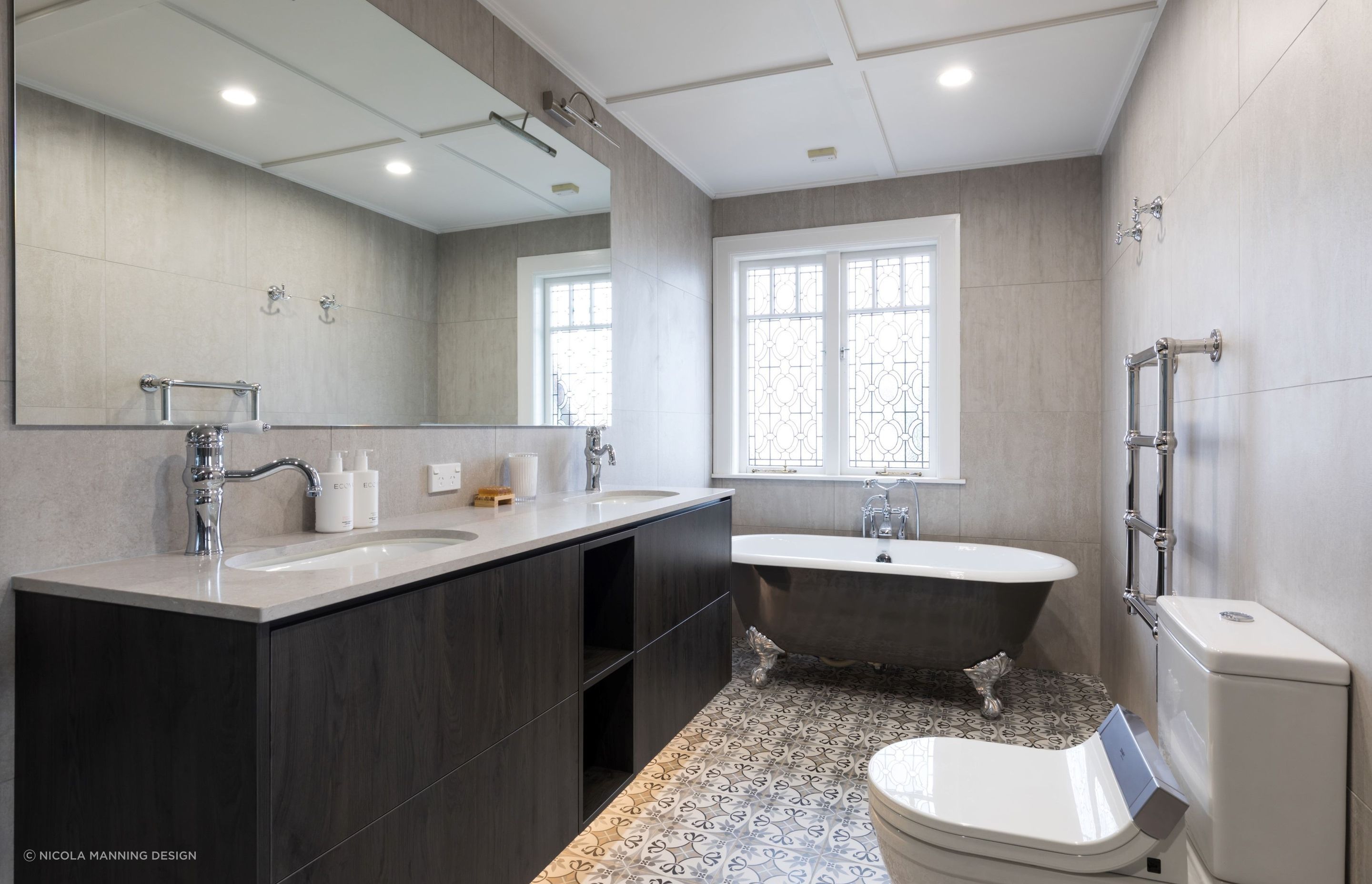 Pristine patterned floor tiles in this beautiful bathroom in St Heliers.