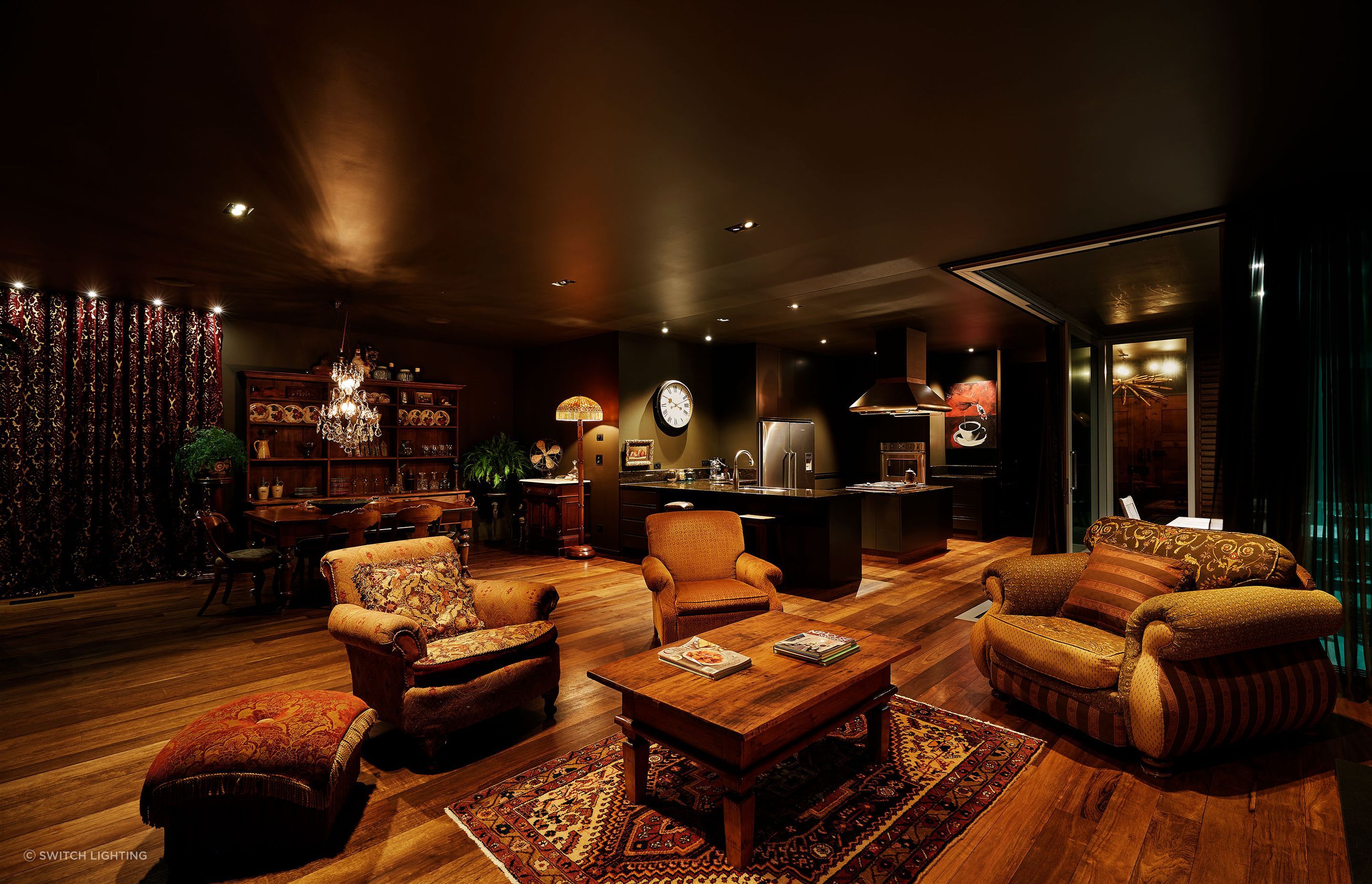 Layered lighting creates a cosy, soft ambience in this living room.