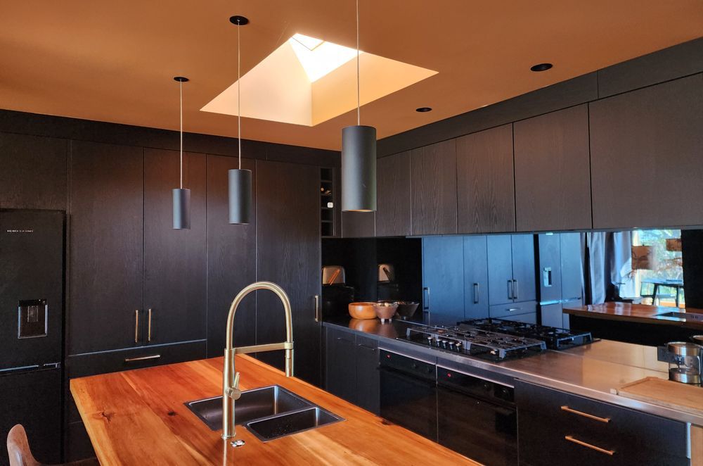 The Switch Lighting ZELA décor Pendant has been applied as task lighting over this kitchen island.