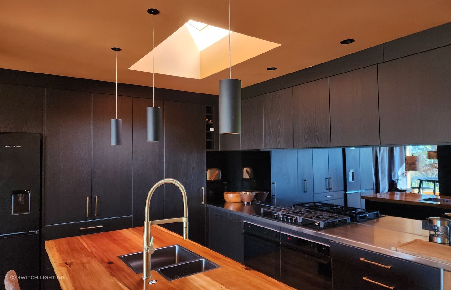 The Switch Lighting ZELA décor Pendant has been applied as task lighting over this kitchen island.