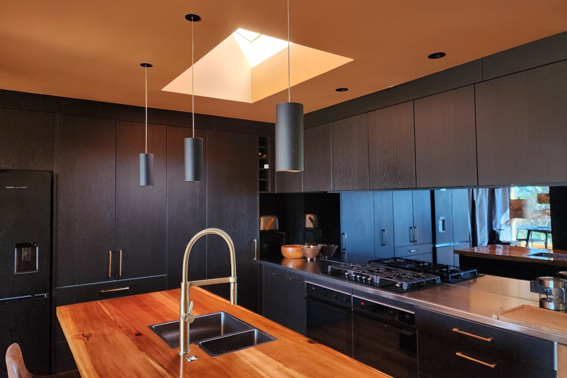 The Switch Lighting ZELA décor Pendant has been applied as task lighting over this kitchen island.
