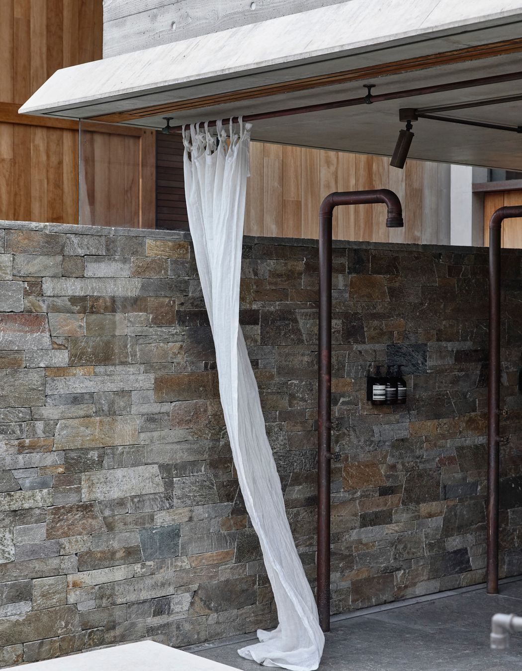 Outdoor shower at Backdune House featuring Baw Baw Dry Stone.