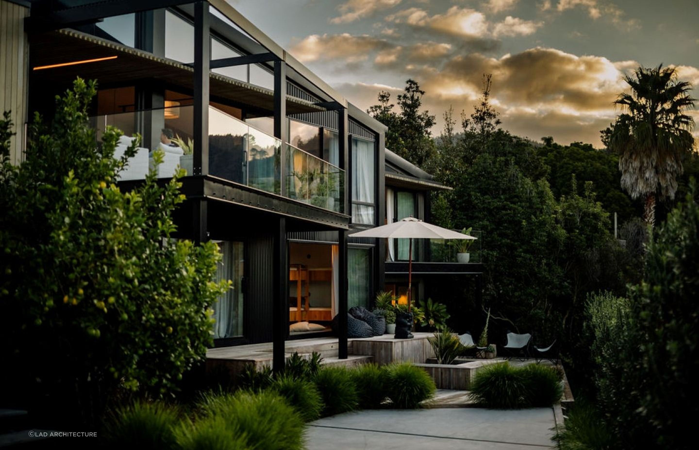 Balconies and decks adorned with pot plants and planters helps this home blend in with its natural surroundings. | Photography: Aaron Radford Photography