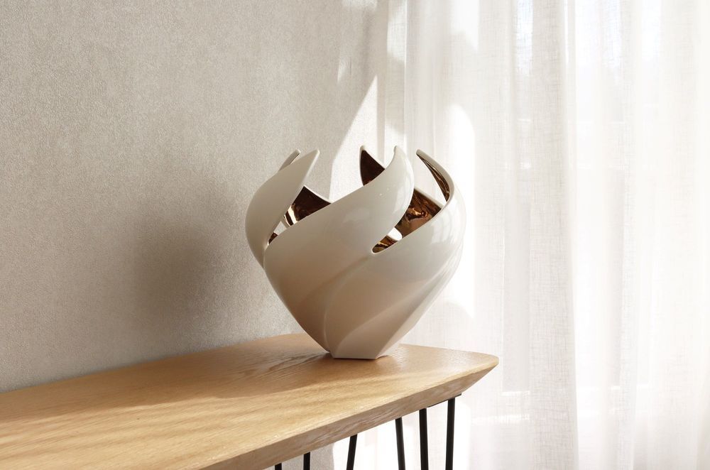 Glossy items of decor, like this exquisite Twisted Vessel vase, can catch lovely highlights on a sunny day.