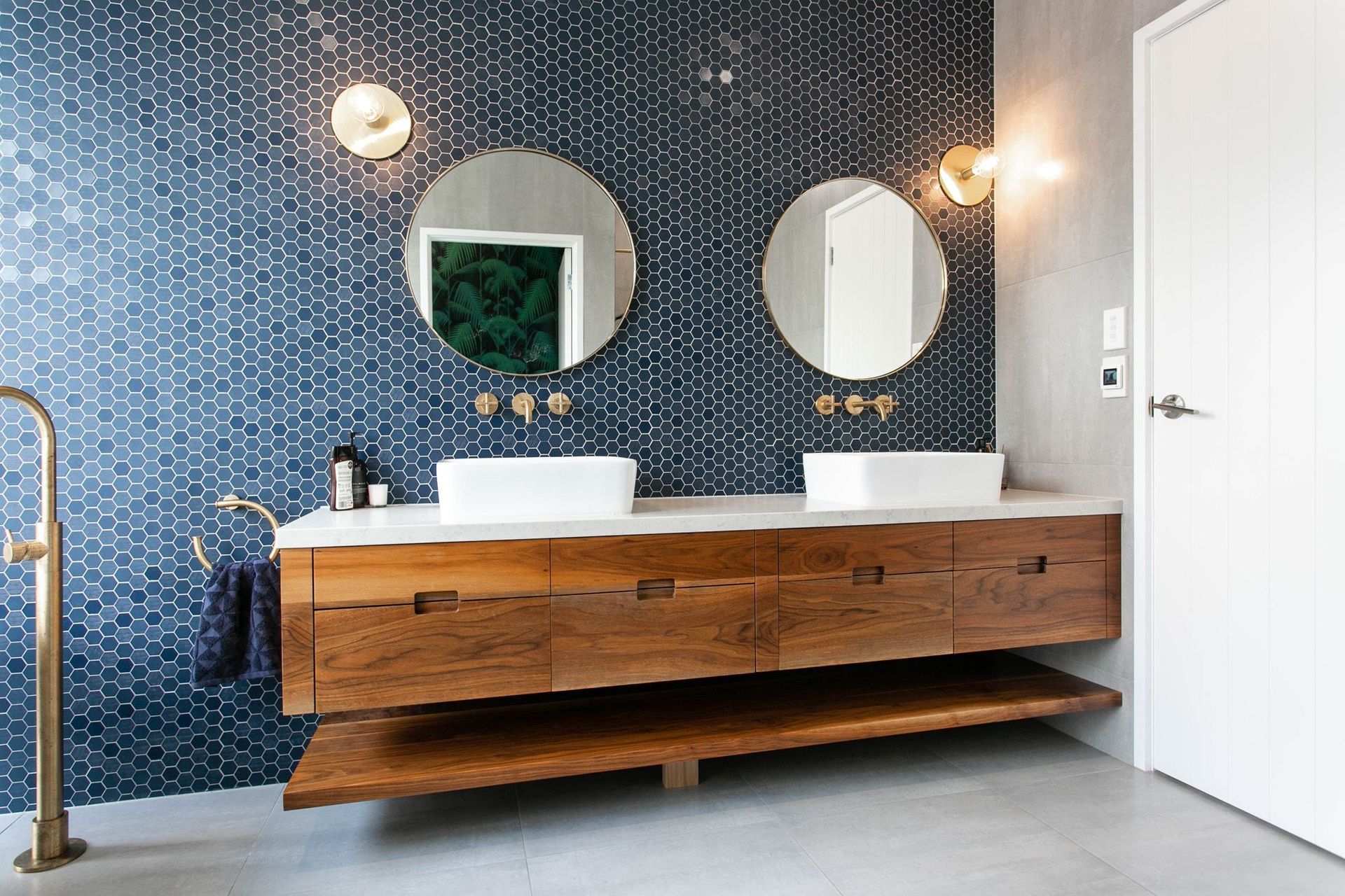 A feature wall of fine hexagon tiles in this Tamahere bathroom renovation.