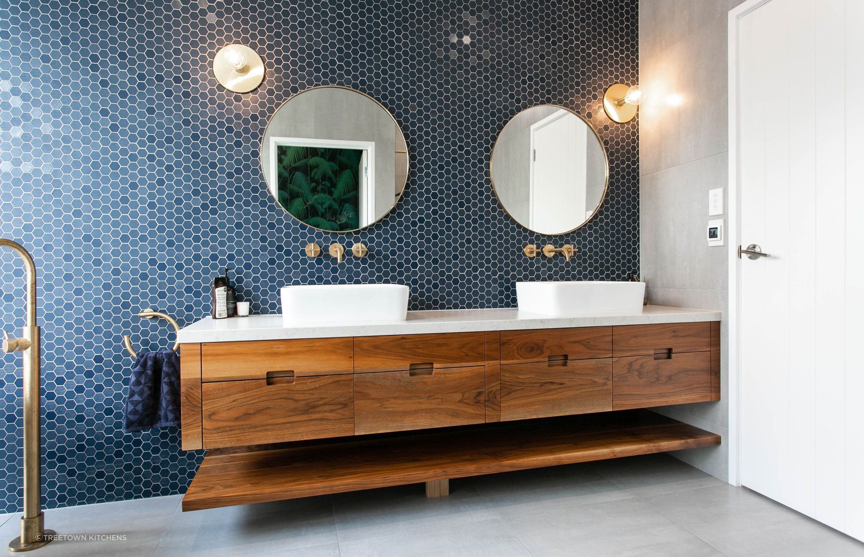 A feature wall of fine hexagon tiles in this Tamahere bathroom renovation.
