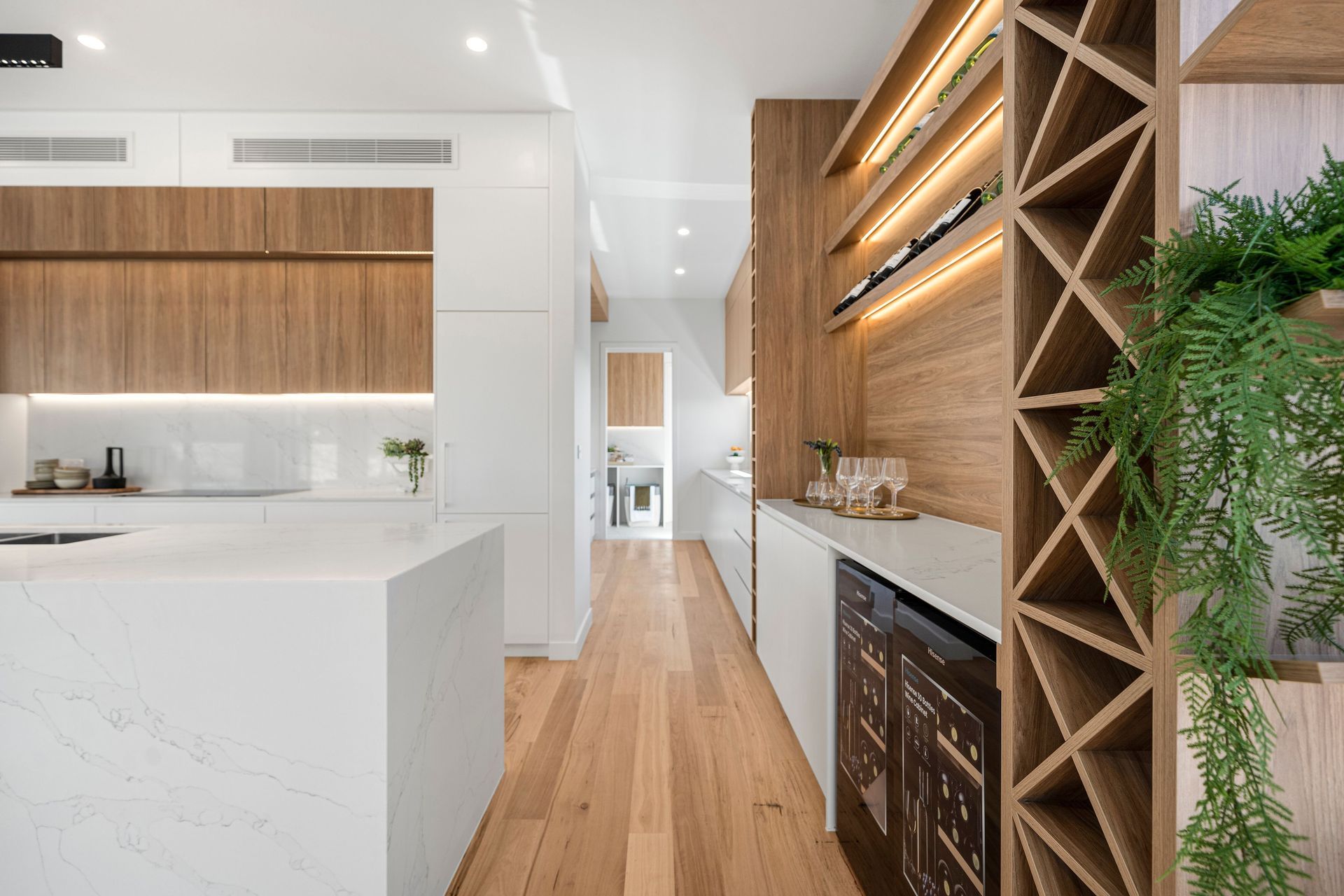 Bringing biophilic elements and materials, such as plants and timber accents, into a space is an easy way to create a sense of serenity.