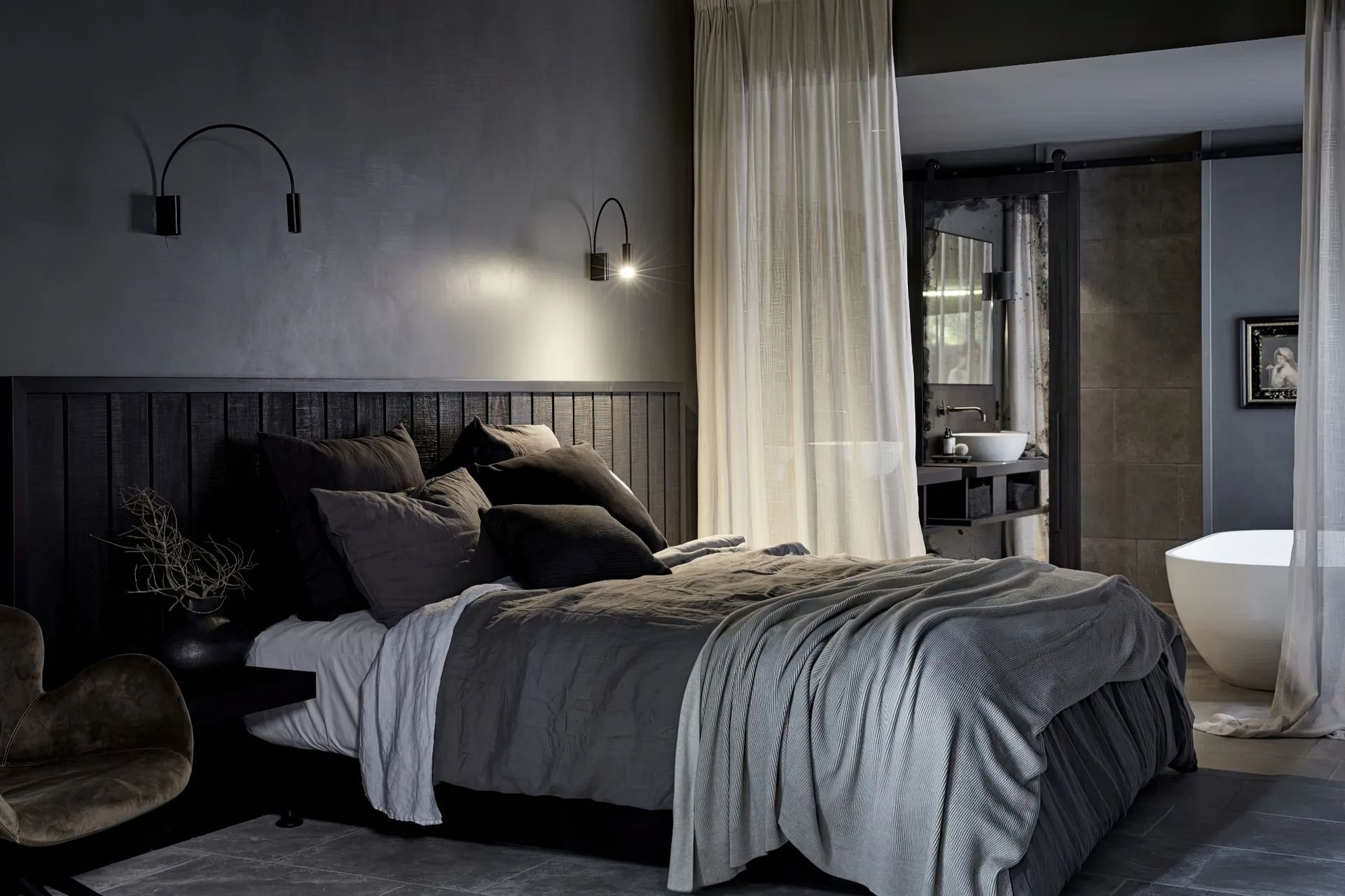 Bemboka linen duvet and reversible rib cotton throw styled in a moody, layered bedroom at The Bower Byron Bay.