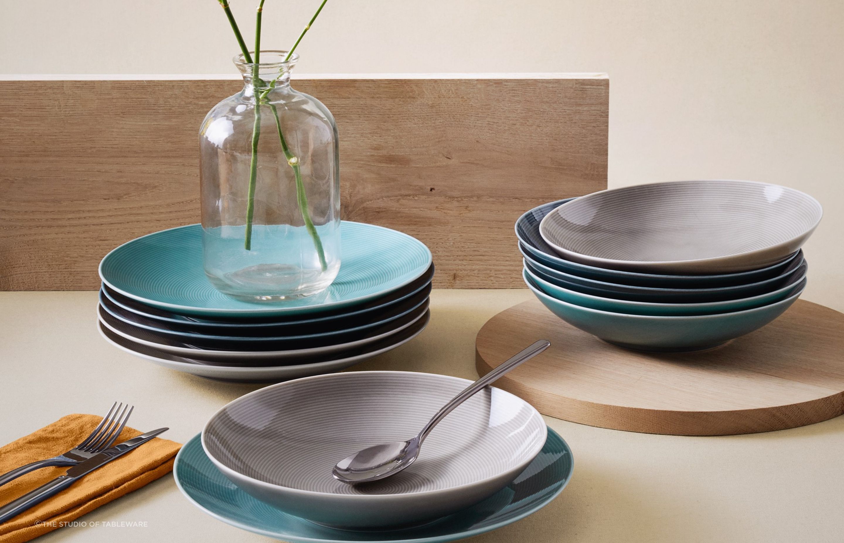 Your dinnerware should complement your dining room decor in colour, shape and style, seen here with Loft Colours Dinnerware by The Studio of Tableware.