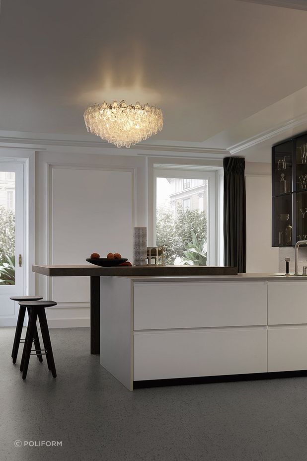 A chandelier immediately draws eyes upwards. Featured product: Trail Kitchen