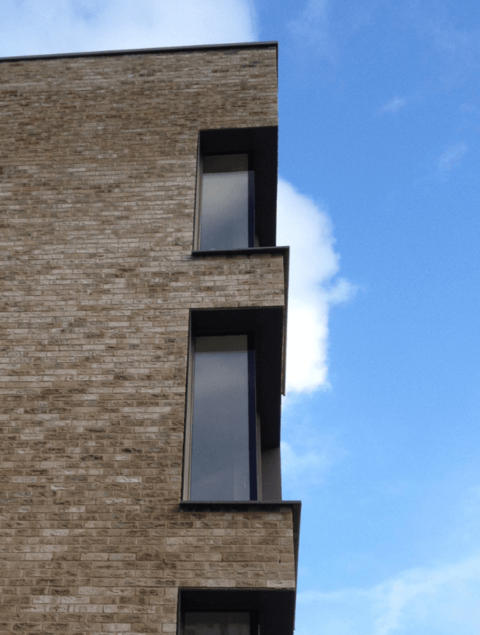 The building should be treated as a single structure.