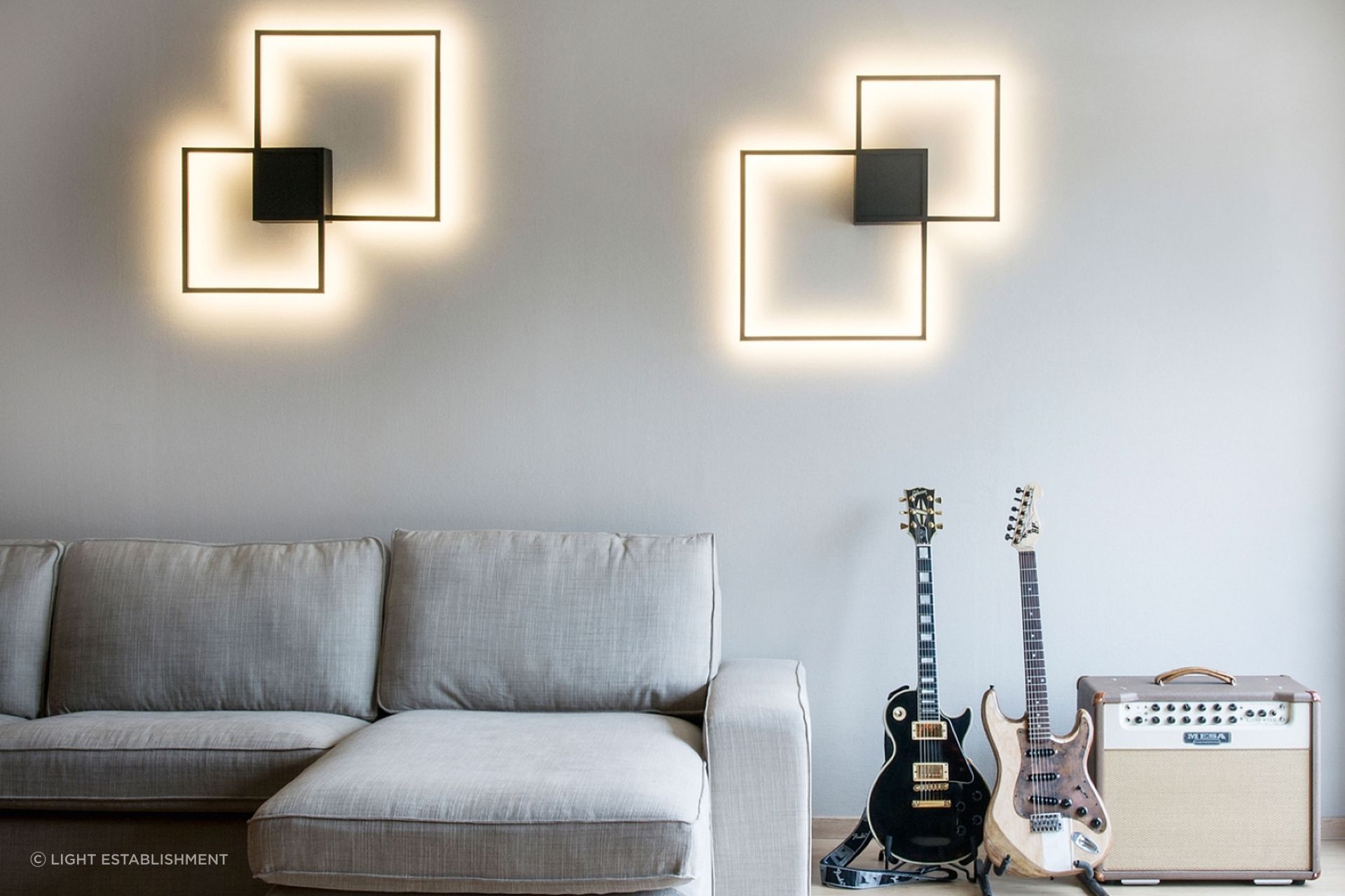 A warm white light colour temperature is perfect for a living room, seen here with the stunning Venn 1.0 Wall Light by Wever & Ducre.