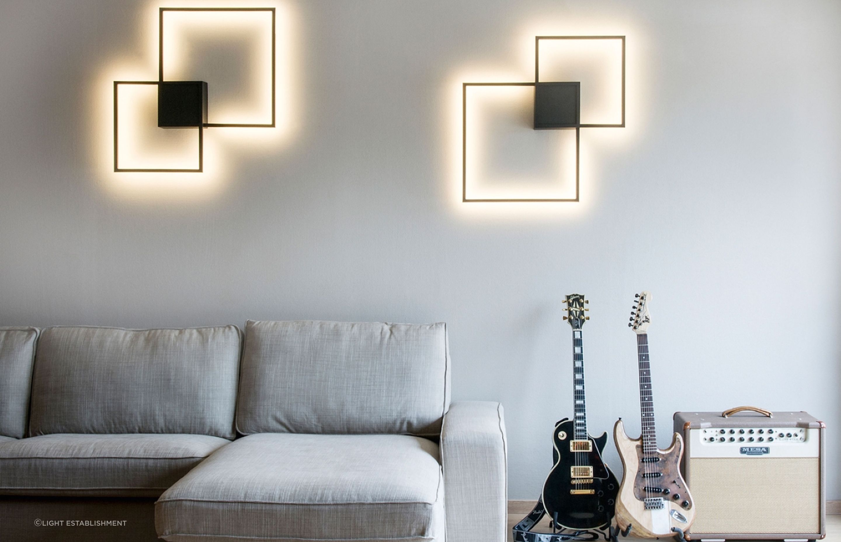 A warm white light colour temperature is perfect for a living room, seen here with the stunning Venn 1.0 Wall Light by Wever &amp; Ducre.