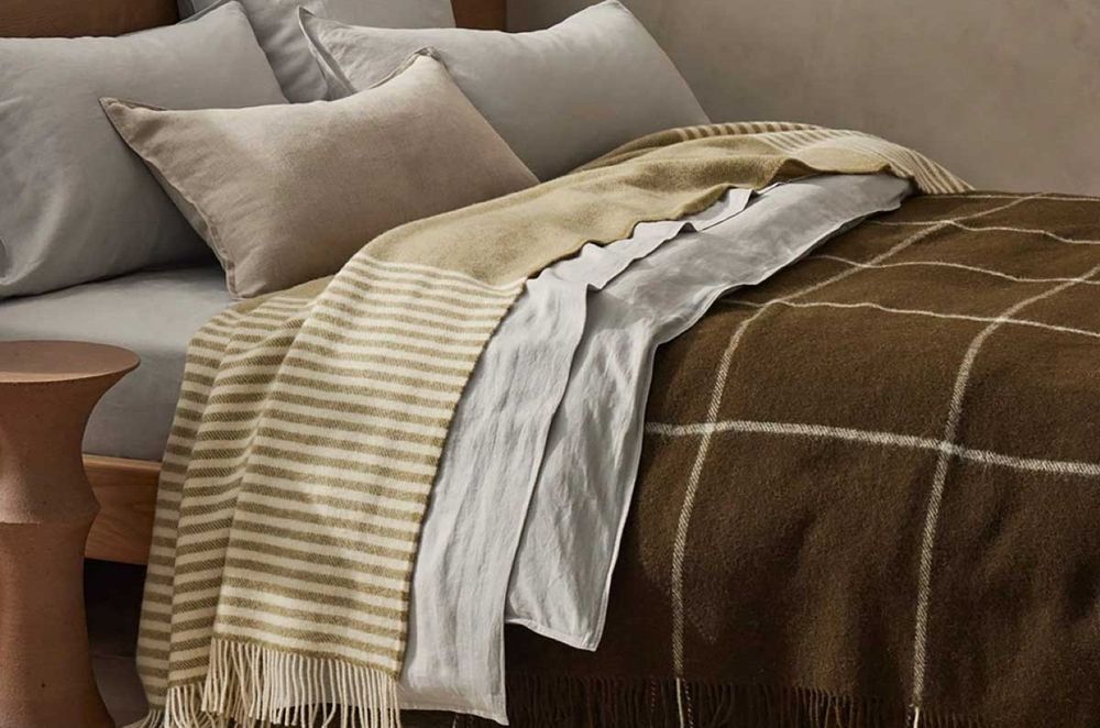 The Weave Home Catlins Wool Throw Blanket by Ink &amp; Brayer adds a beautiful accent of texture and colour.