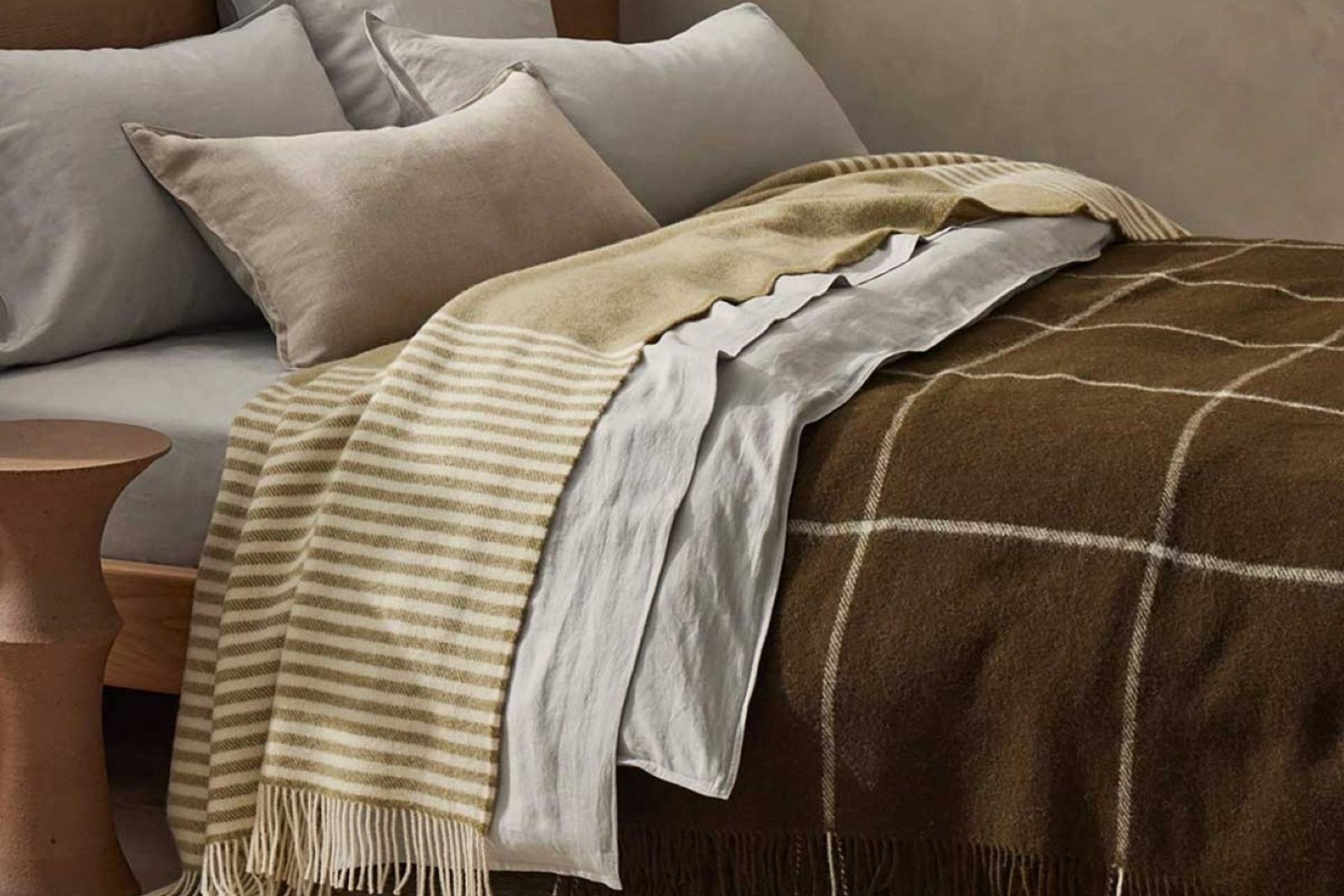 The Weave Home Catlins Wool Throw Blanket by Ink & Brayer adds a beautiful accent of texture and colour.