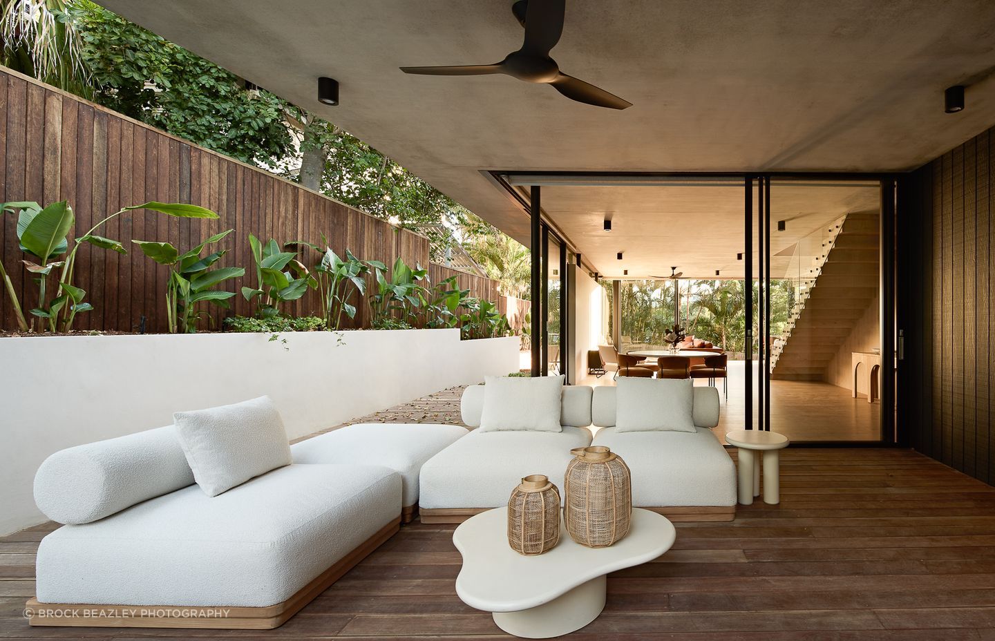 Wilflower Residence by Reitsma & Associates. It's not always necessary to have direct sunlight in an outdoor living space; using wide overhangs and screen planting can filter light in more softly.