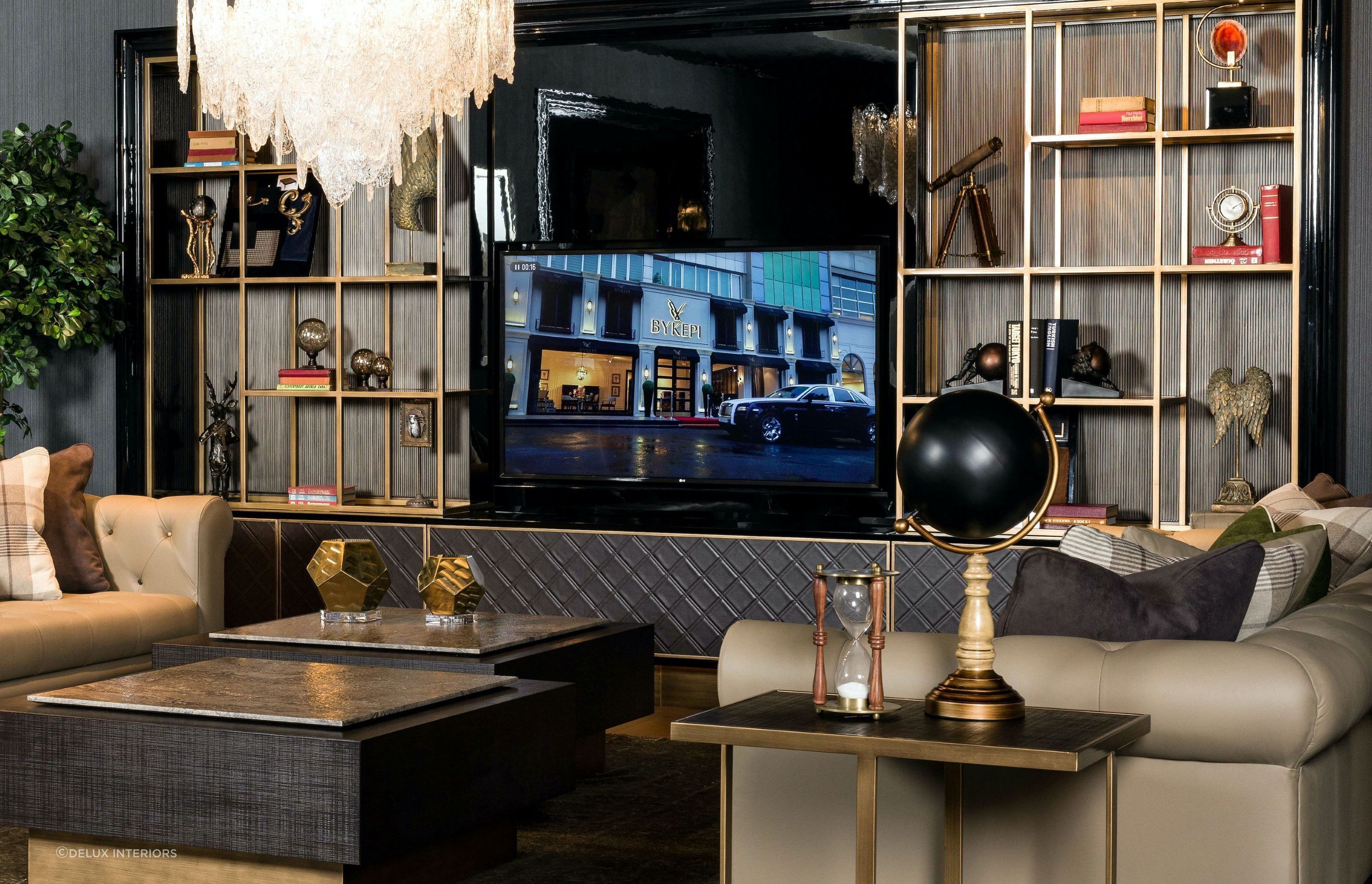 The inclusion of personal items and collections, superbly done here with the West Wall Unit from DeLux Interiors, can add character to a space.
