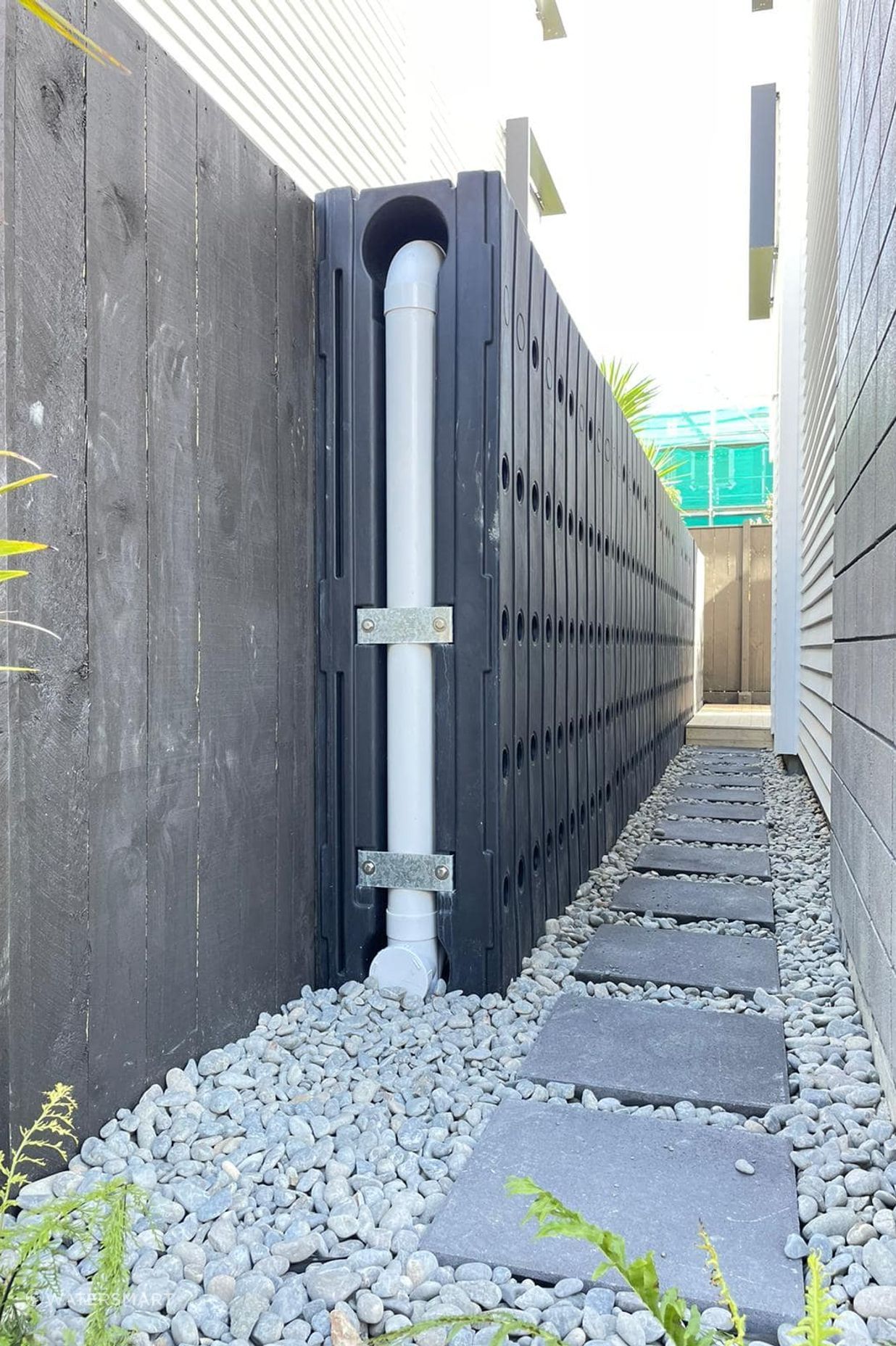 In Belmont, Auckland, Watersmart's Williamson Ave project saw five 1,000L tanks installed along the fenceline of each lot. The solution met all stormwater and boundary requirements, and most importantly, allowed the new homeowners enough reasonable space to access their backyards by walking down the side of their house if needed.