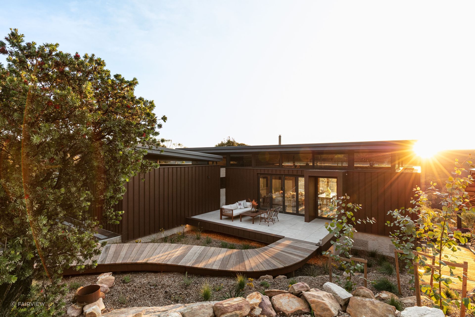 The cladding features distinctive tall, sharp ribs and flat smooth pan profiles, creating a bold and modern look in both rural and urban settings. Featured product: Vitraloc - Roll Formed Steel Cladding.