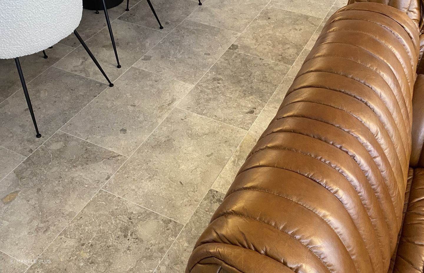 Marble tiles are suitable for kitchens and living spaces alike.