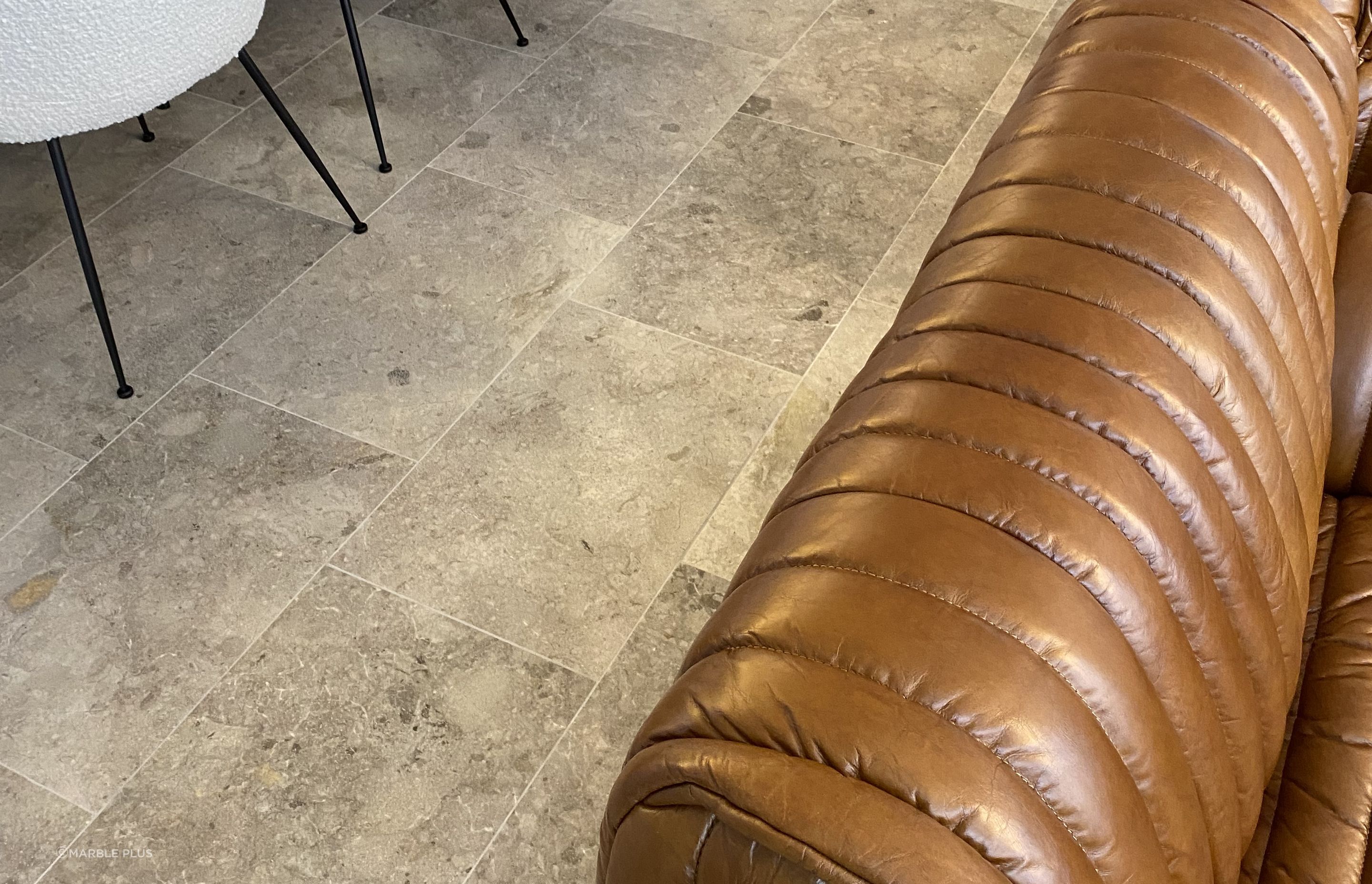 Marble tiles are suitable for kitchens and living spaces alike.