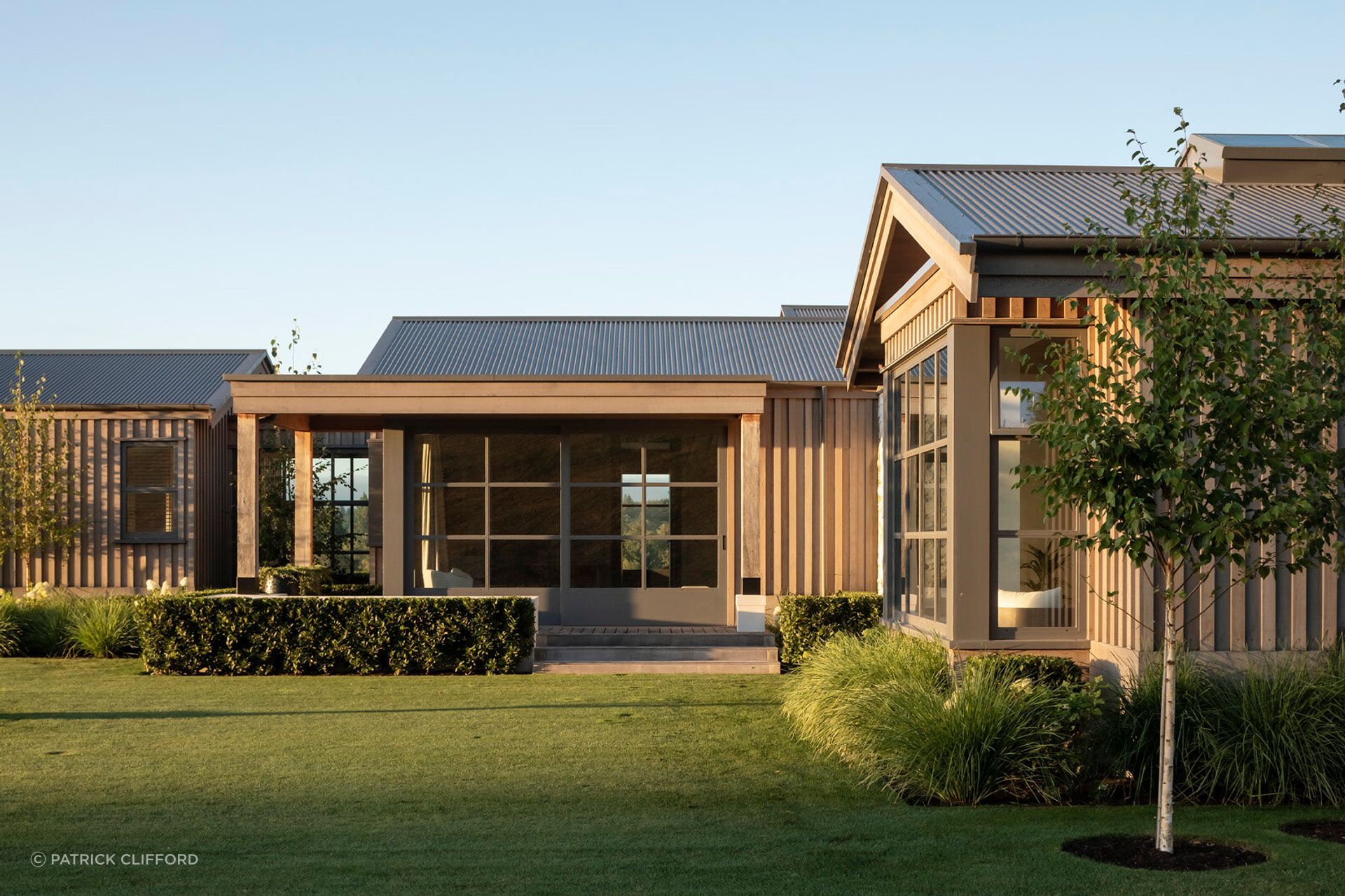 At Wairakei, robust rural forms and natural materials are composed around retreat, gathering and connection to the landscape, creating a private lodge that feels both enduring and deeply attuned to its golf-course setting. Architecture: Christian Anderson Architects