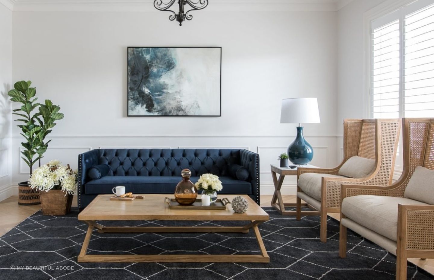 Beach-inspired wall art and accessories are the perfect finishing touches in this living room.