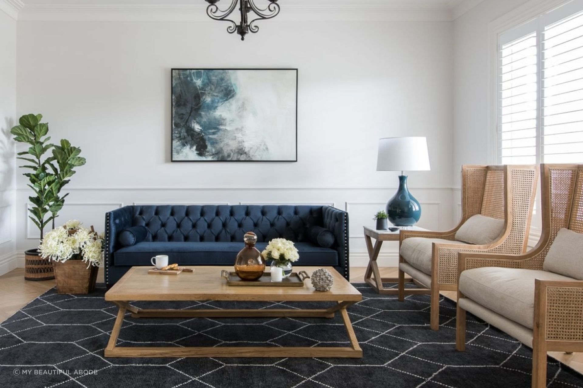 Beach-inspired wall art and accessories are the perfect finishing touches in this living room.