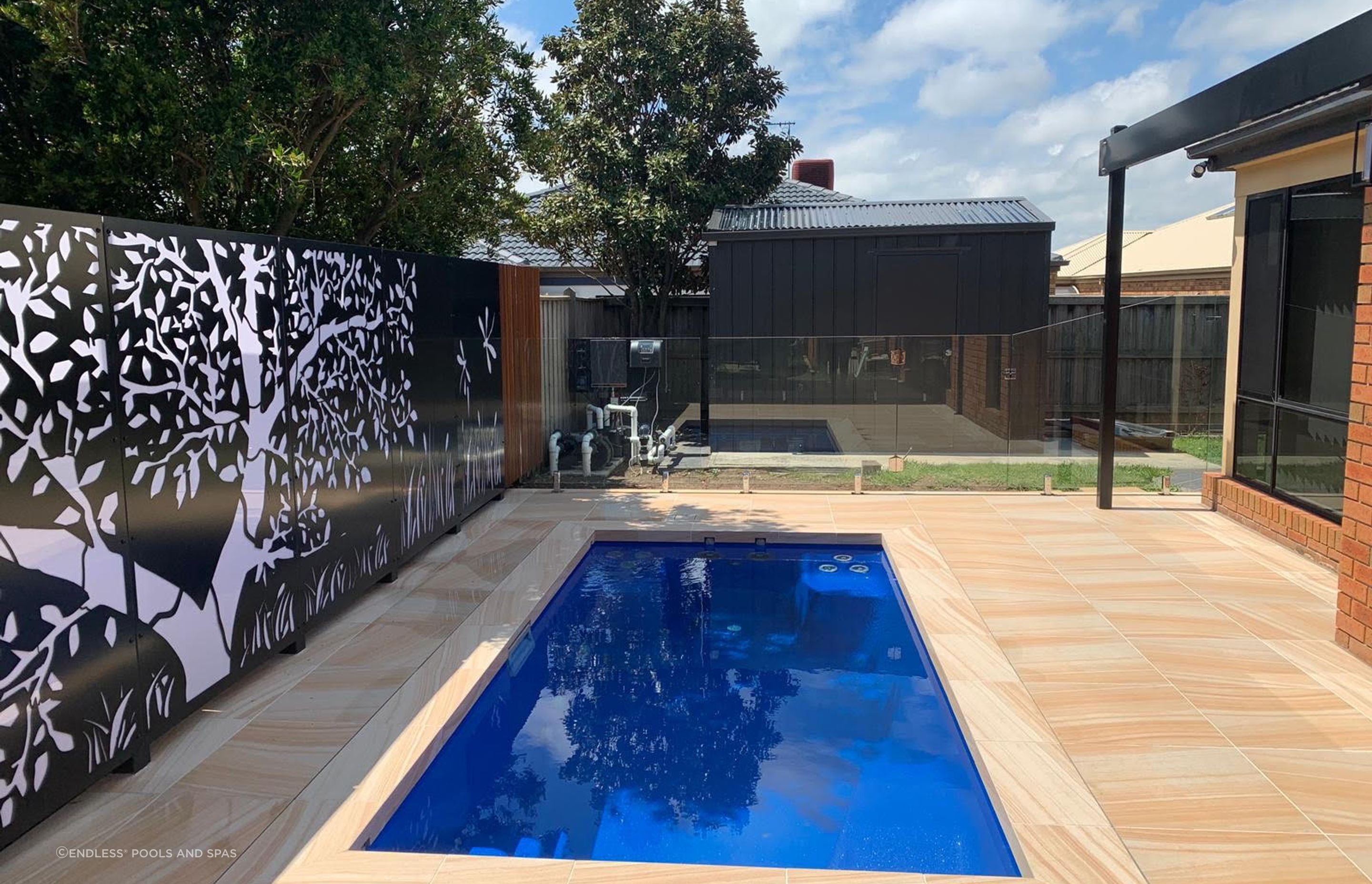 In-ground plunge pool can often be integrated into an existing outdoor feature such as deck or patio. Featured Product: Jaguar by Endless Pools and Spas.