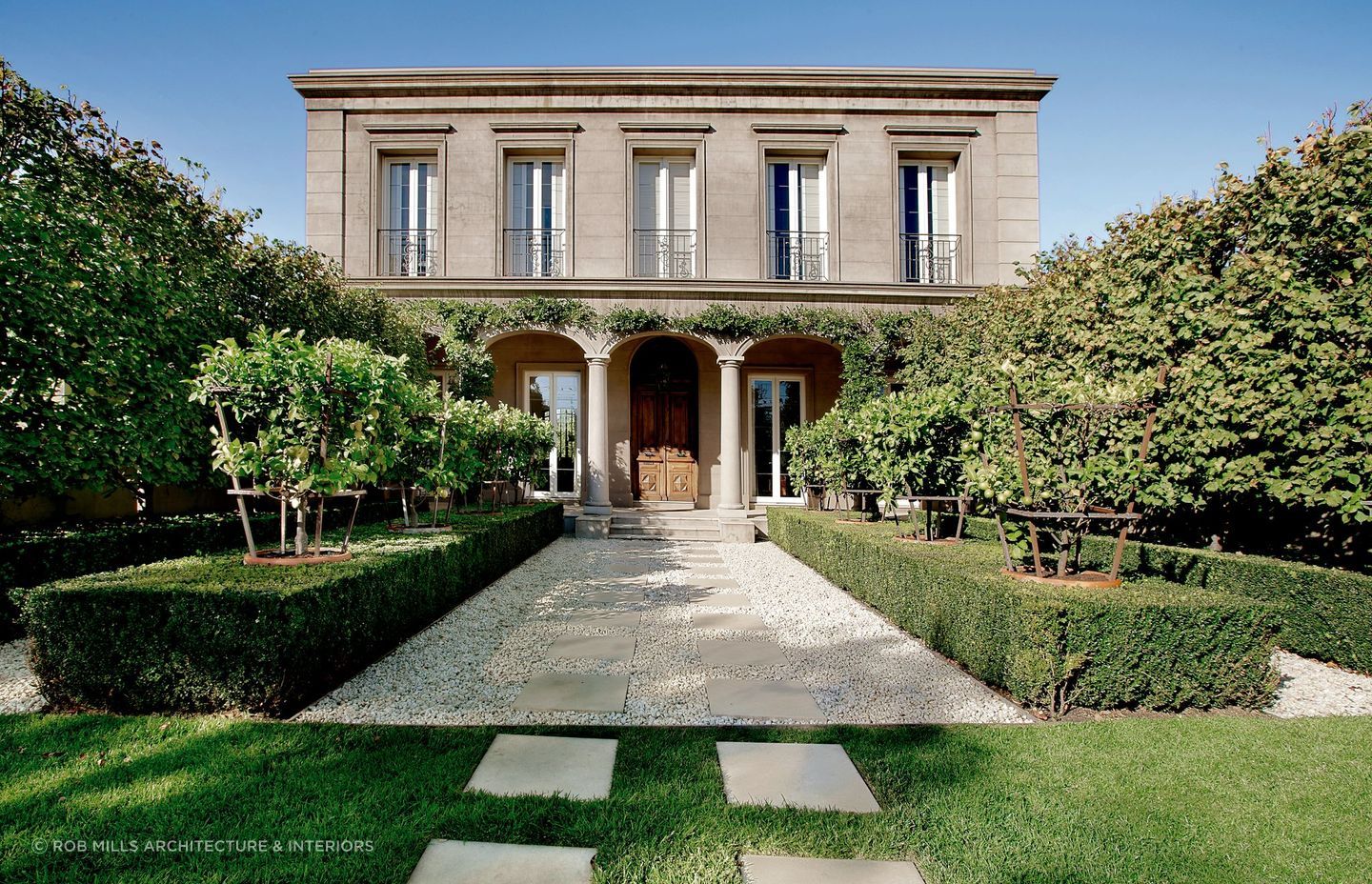 The relaxed entryway to Kenley Court in Toorak is the perfect lead-up to this property's stunning 18th-century entrance doors. Featured project: Kenley Court by Rob Mills Architecture and Interiors