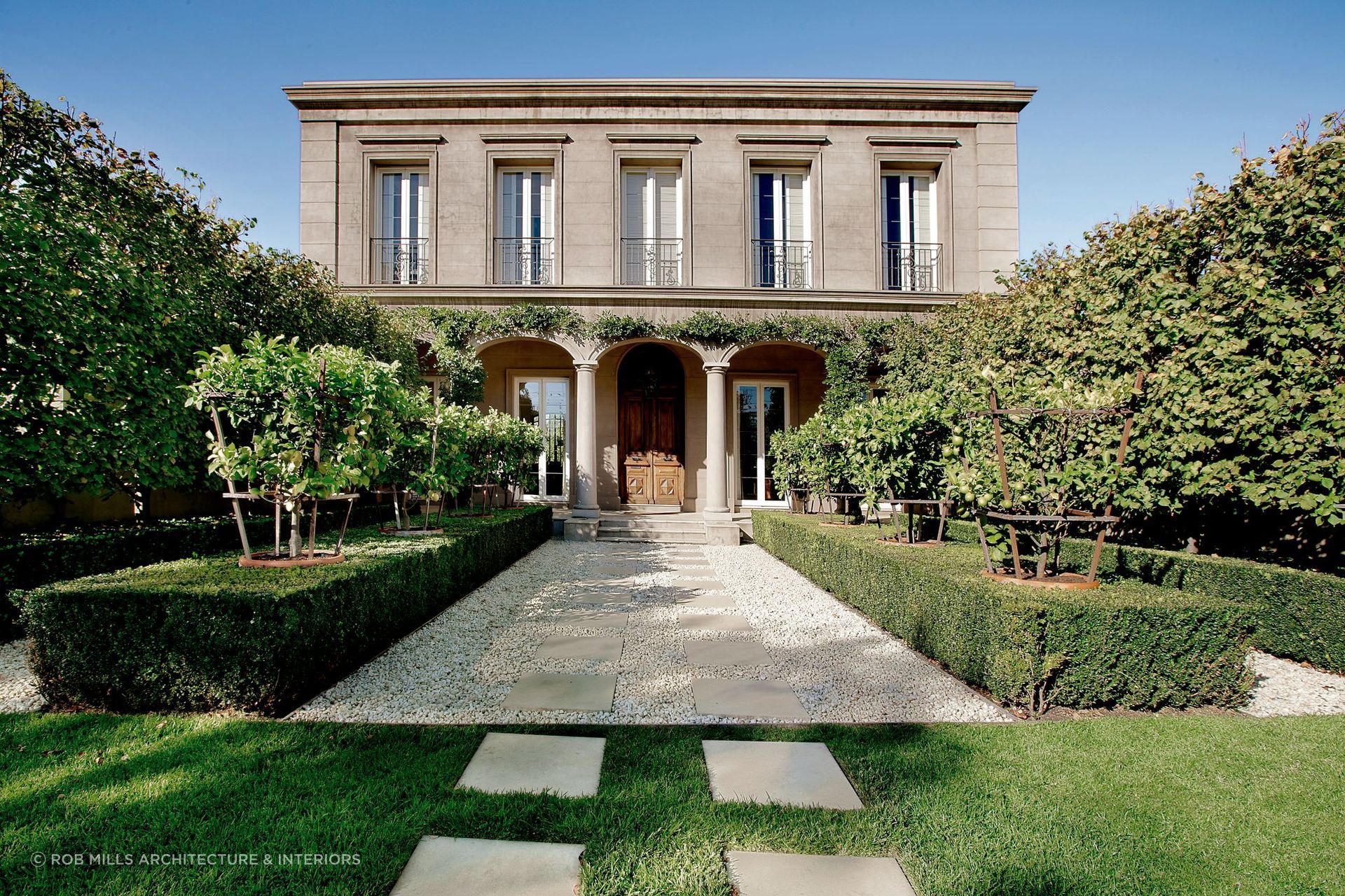 The relaxed entryway to Kenley Court in Toorak is the perfect lead-up to this property's stunning 18th-century entrance doors. Featured project: Kenley Court by Rob Mills Architecture and Interiors