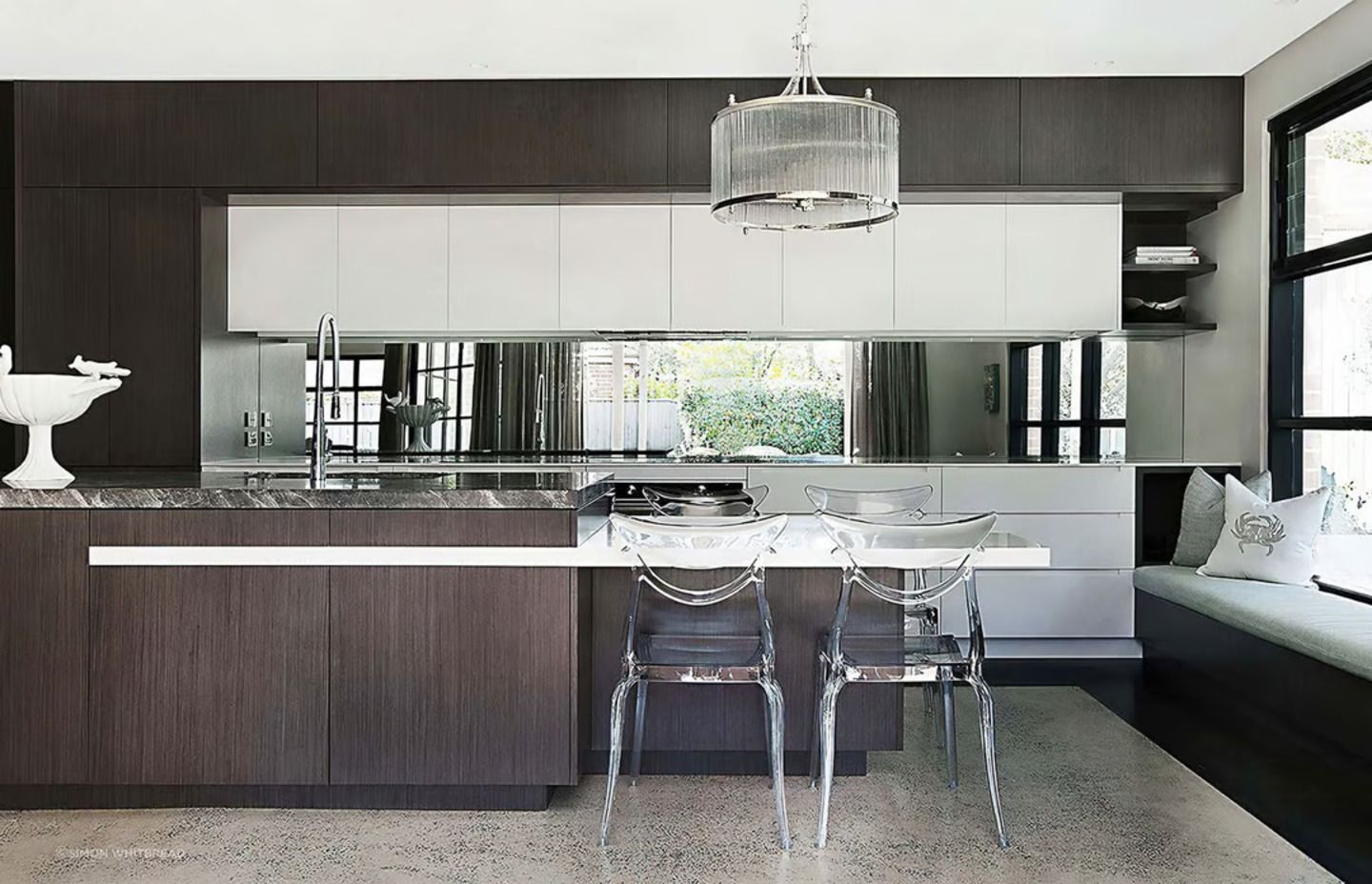 A stylish kitchen bench where seating has been considered in the design.