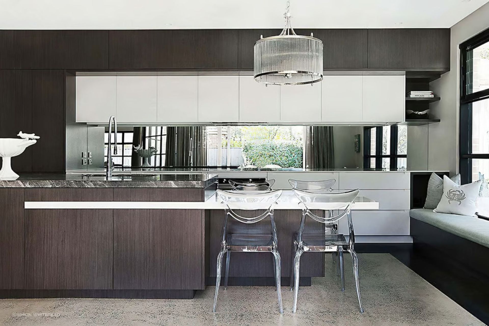 A stylish kitchen bench where seating has been considered in the design.