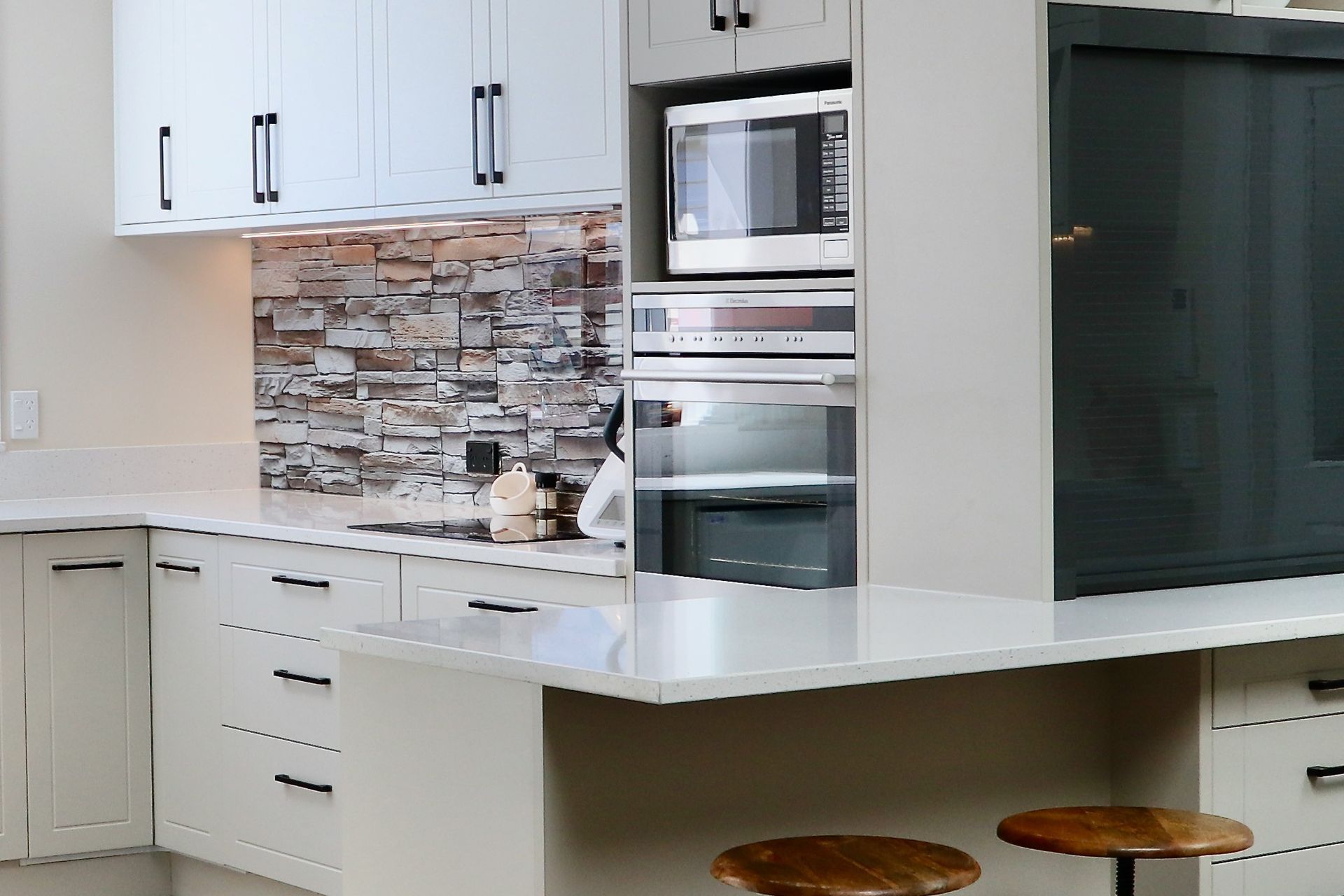 A thoroughly convincing take on the brick splashback in this clever kitchen renovation.
