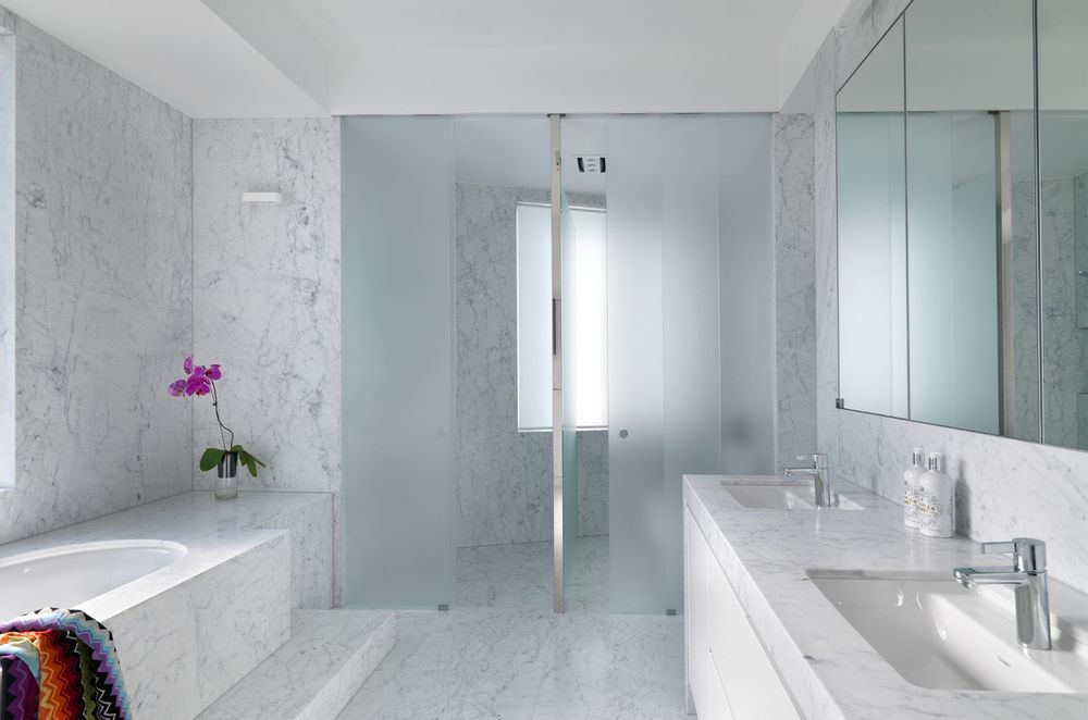 Floor tiles, wall tiles and shower tiles can all carry cohesive design. Featured Project: Luxe Ensuite Bathroom by RCI Designs
