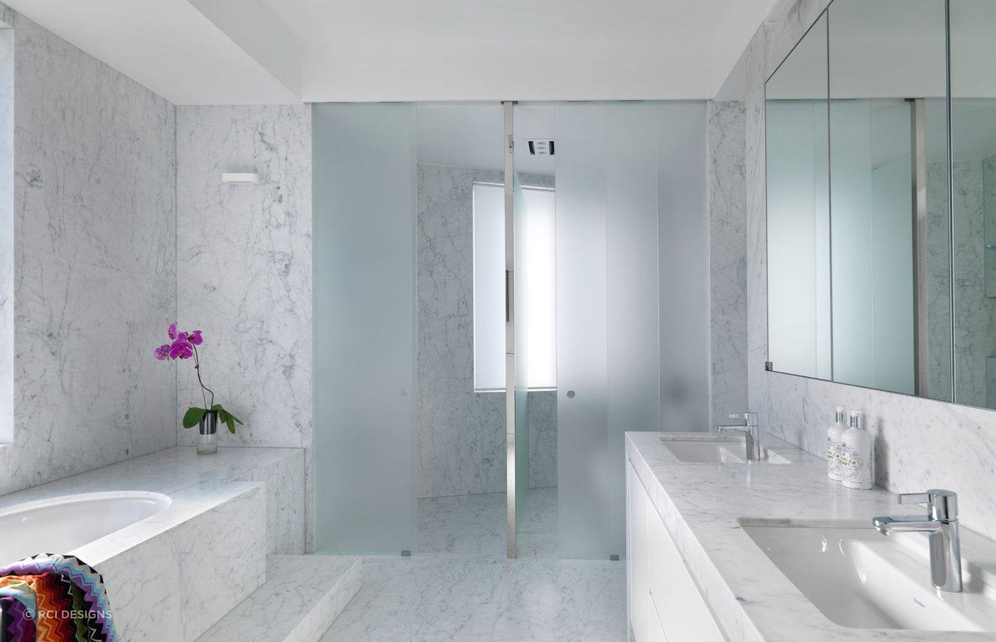 Floor tiles, wall tiles and shower tiles can all carry cohesive design. Featured Project: Luxe Ensuite Bathroom by RCI Designs