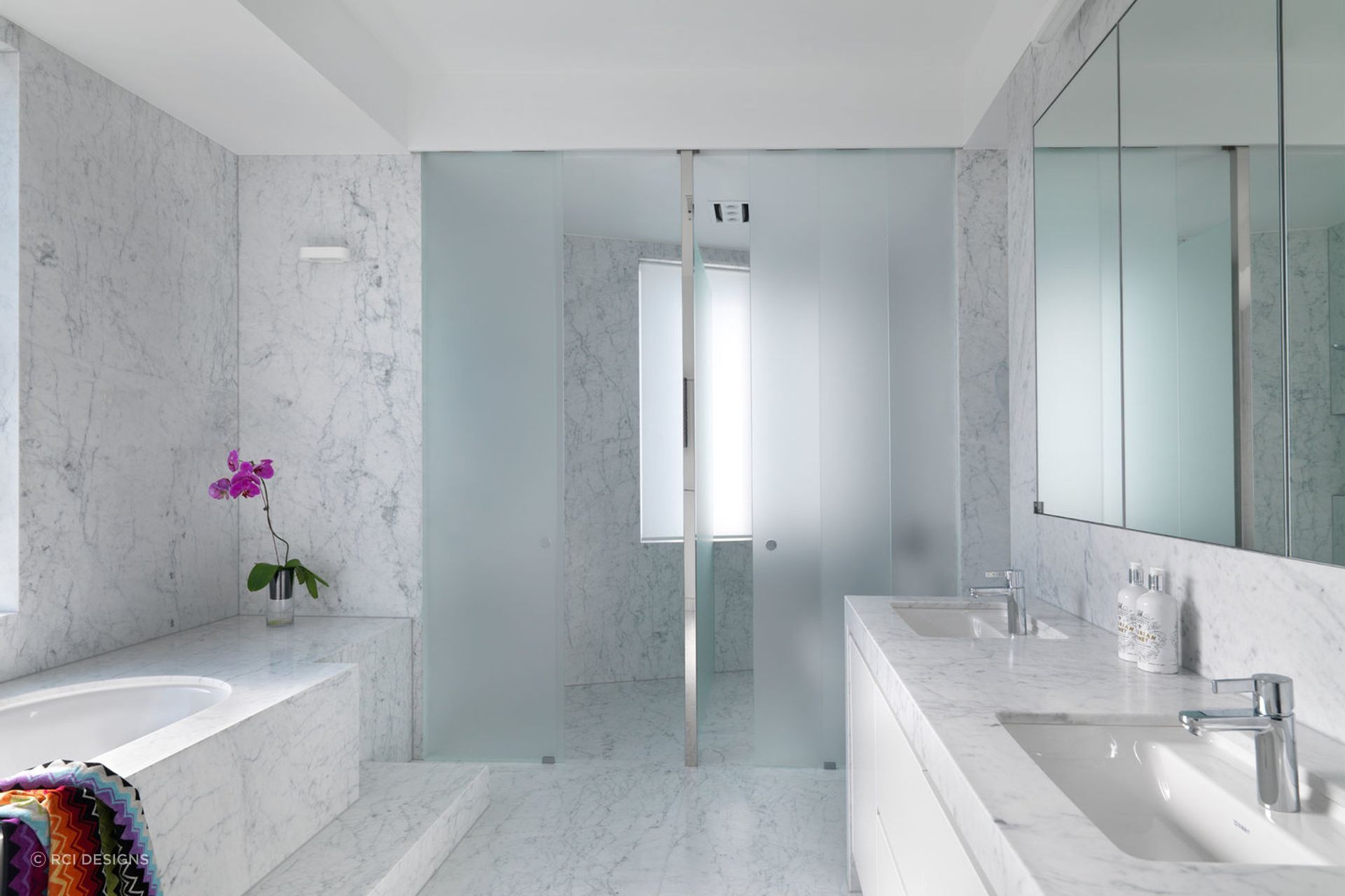 Floor tiles, wall tiles and shower tiles can all carry cohesive design. Featured Project: Luxe Ensuite Bathroom by RCI Designs