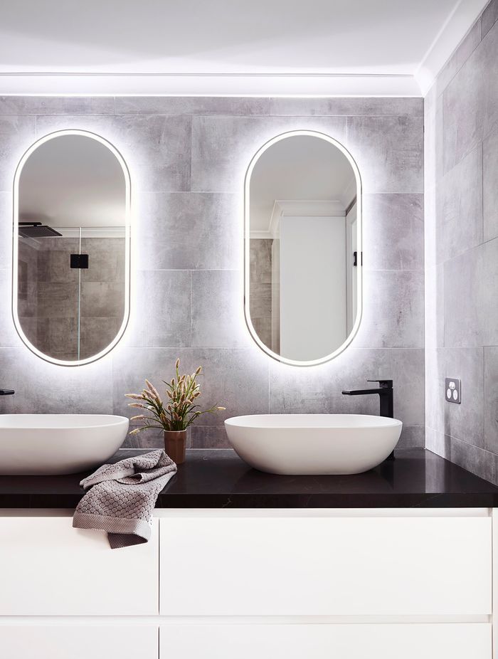 Lighted mirrors are a convenient way to add functionality and extra light to a bathroom