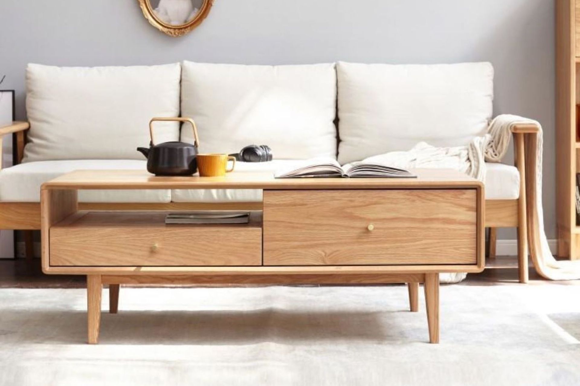 A trendy teapot adds warmth to this living space, featuring the homely Oslo Natural Solid Oak Coffee Table.