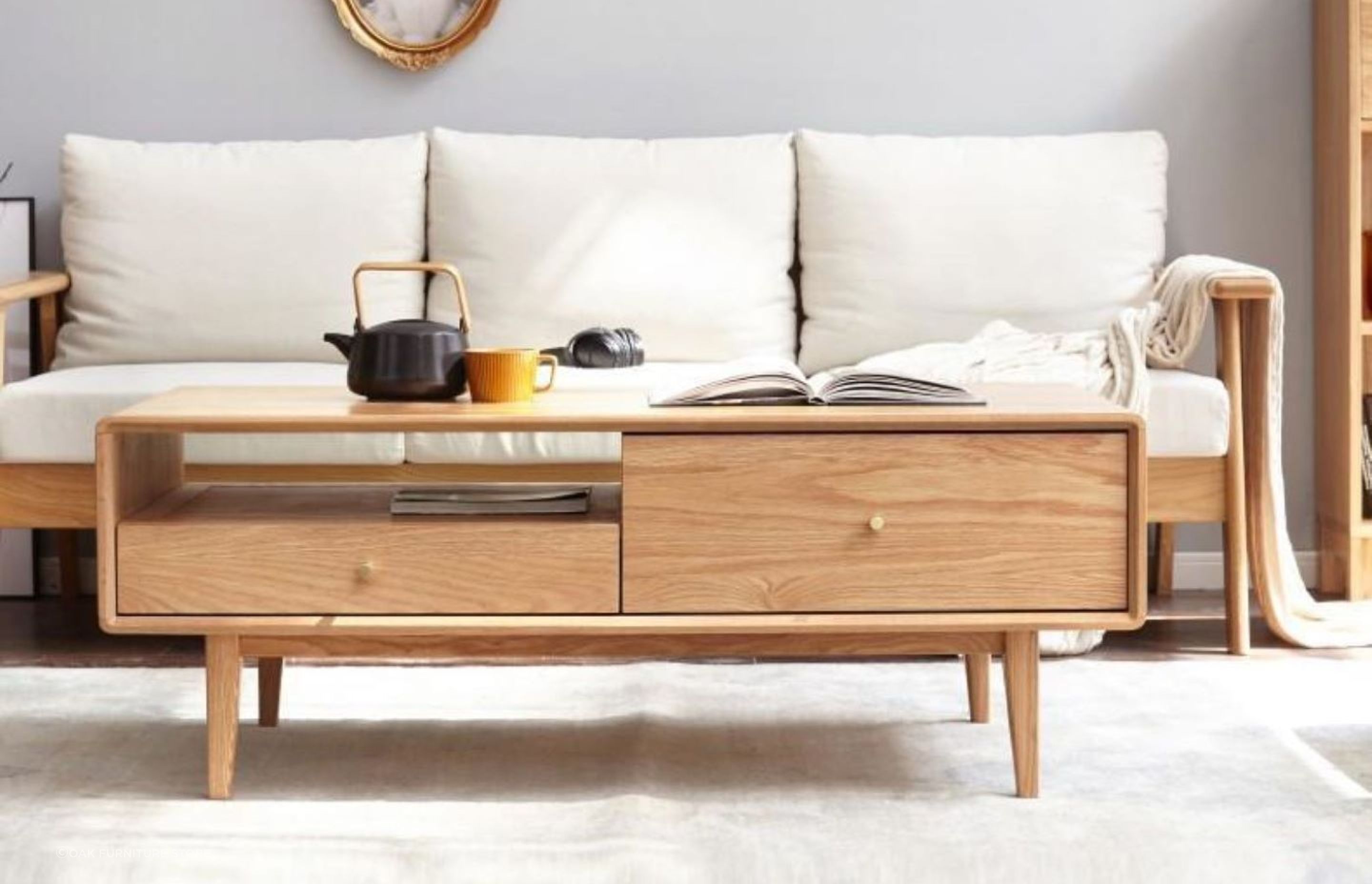 A trendy teapot adds warmth to this living space, featuring the homely Oslo Natural Solid Oak Coffee Table.