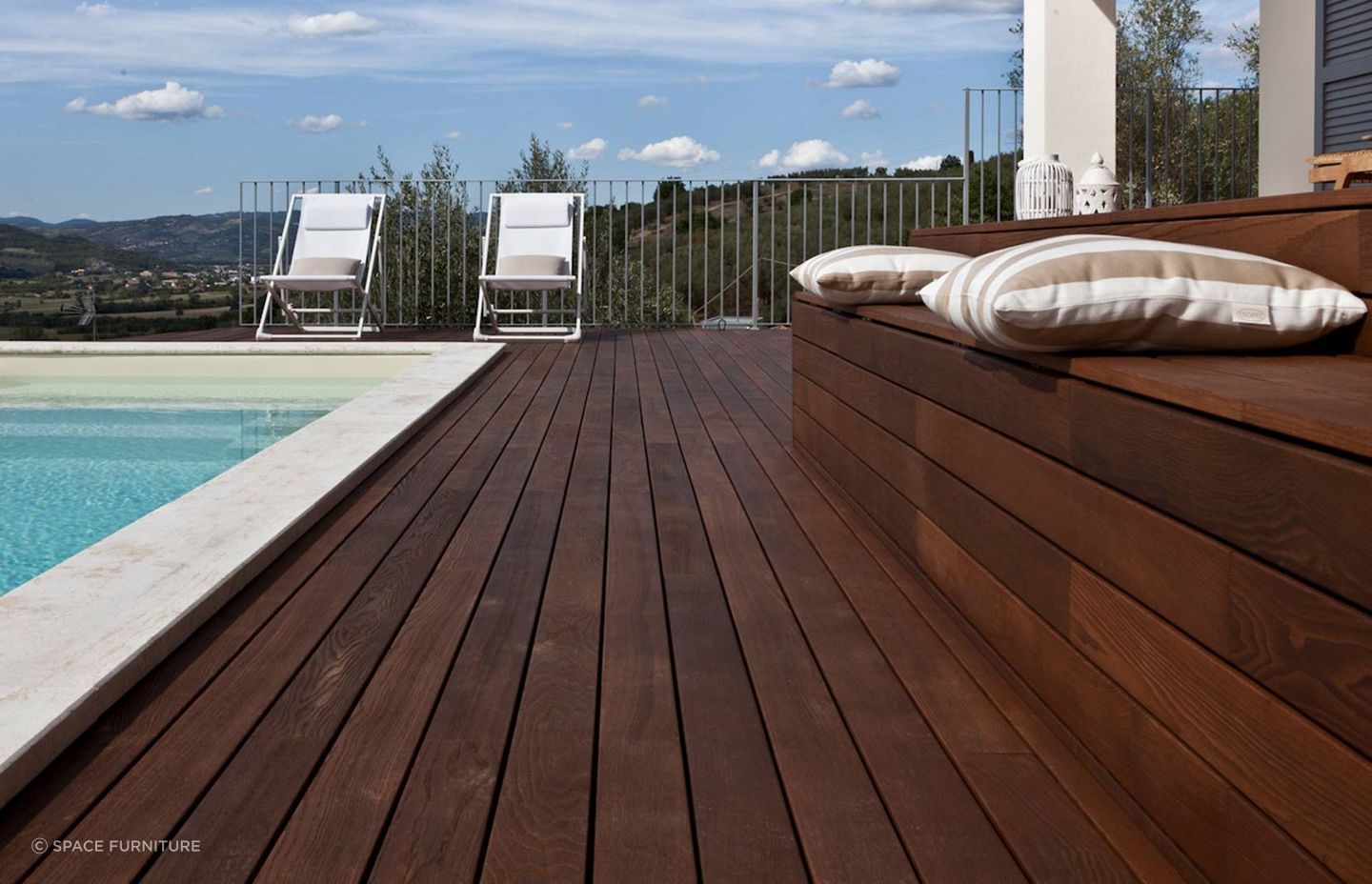 Built in seating, like this made from Listone Giordano Outdoor Decking by Space Furniture, offers seamless design aesthetics.