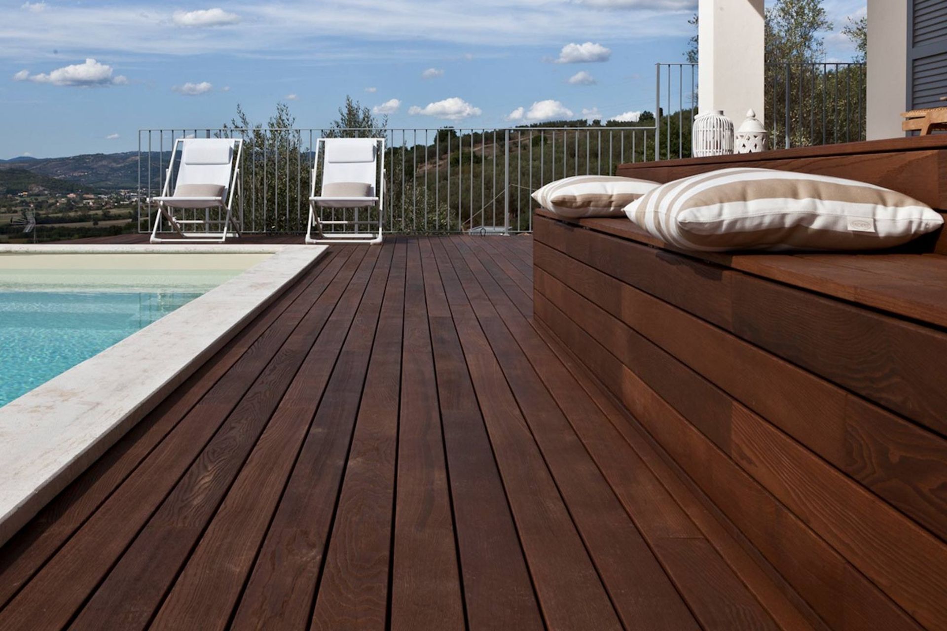 Built in seating, like this made from Listone Giordano Outdoor Decking by Space Furniture, offers seamless design aesthetics.