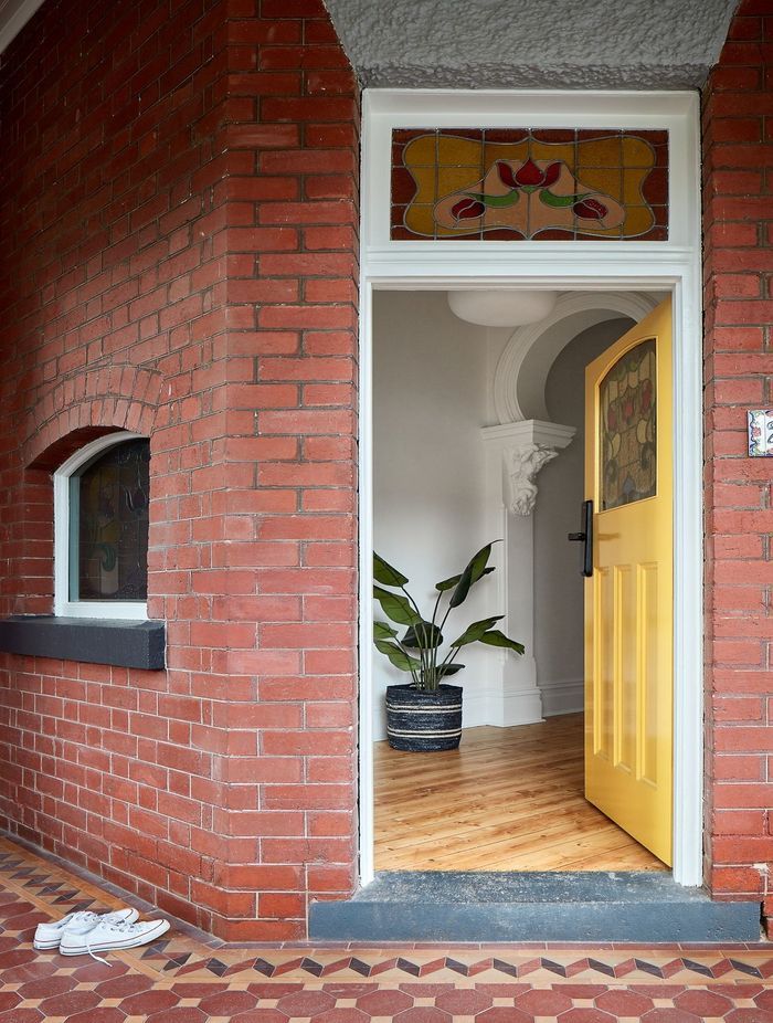 A yellow front door gives a home a bright, welcoming feeling. Featured project: Pine by Bryan Alsop Architects