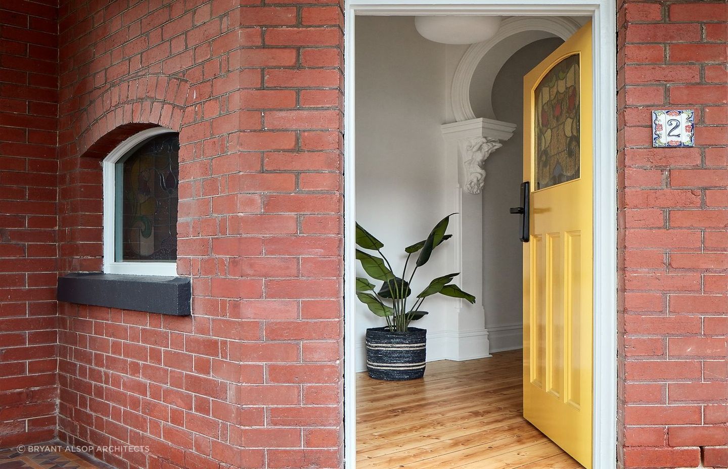 A yellow front door gives a home a bright, welcoming feeling. Featured project: Pine by Bryan Alsop Architects
