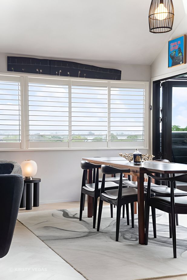 This space was elevated by the client’s original Bernard Vuarnesson dining table and Wegner chairs, paired with an Artisan “Ink Vapour” rug, Simon James “Offset” stool, “Bloom” lamp and Tom Dixon accessories—timeless pieces that endure.