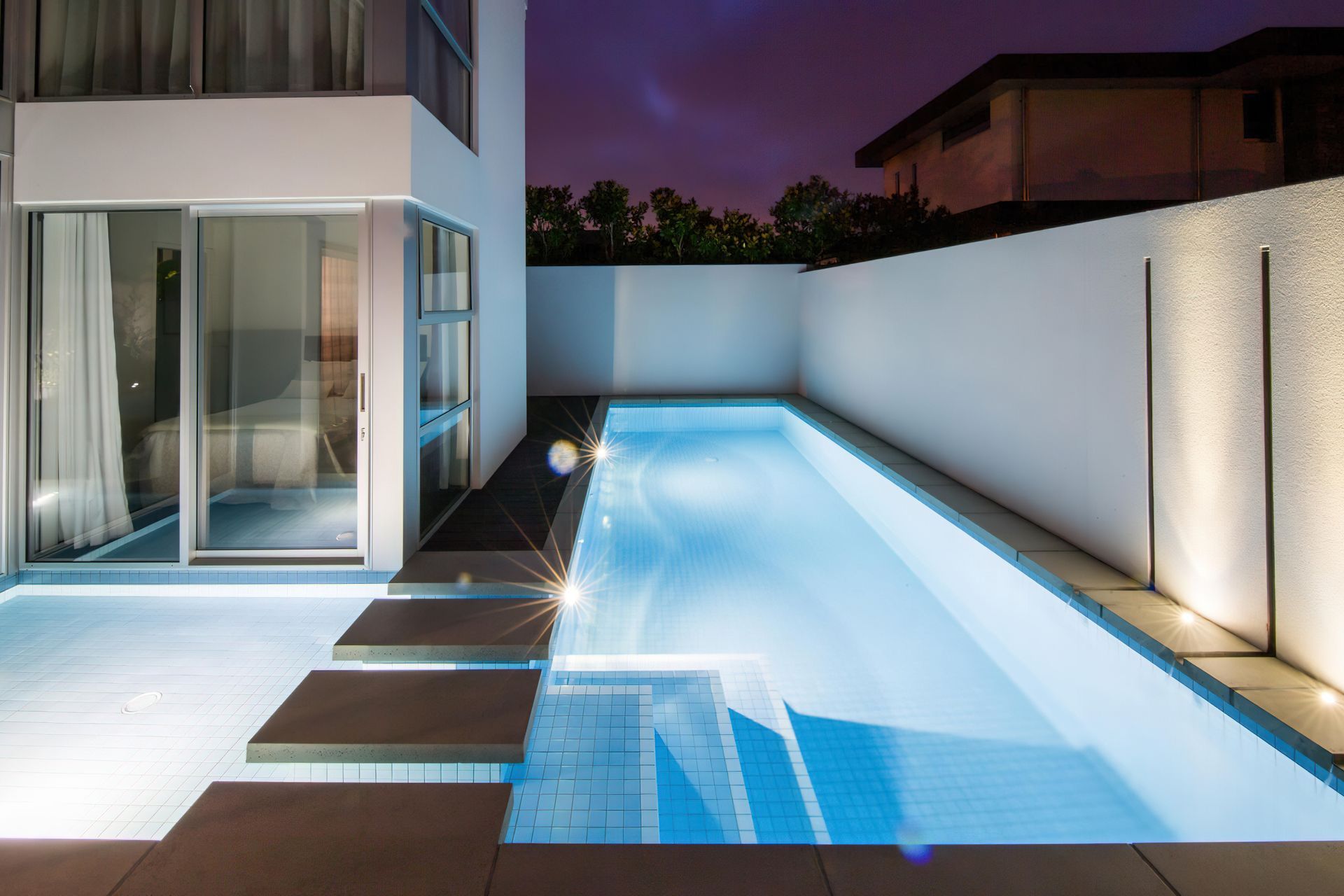 This shotcrete pool by Pioneer Unique Pools & Spas makes use of every inch of its tight suburban site.