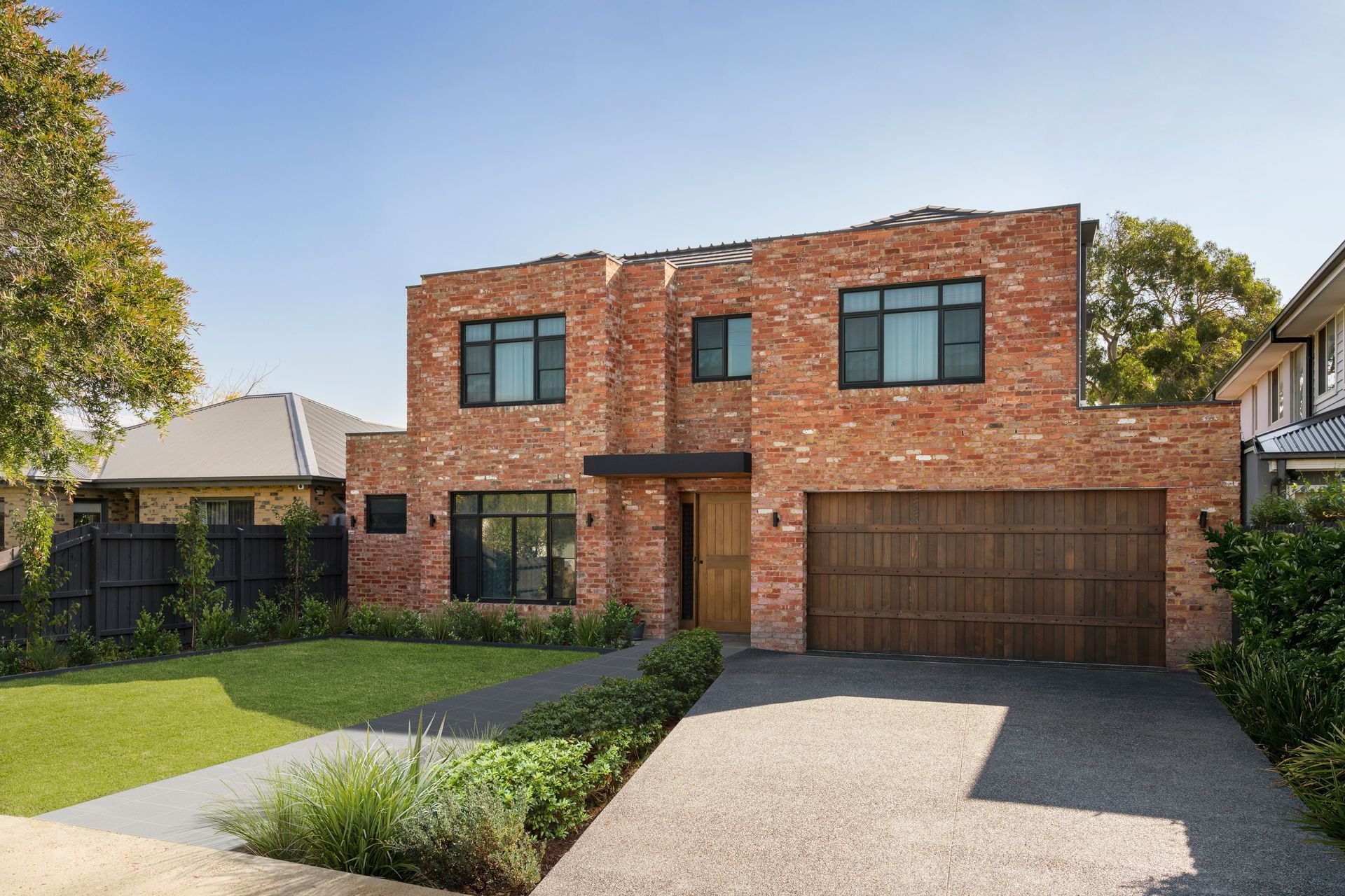 The tonality differences between the front door and the brickwork creates a striking statement. Featured project: Project One by Trinity Architects
