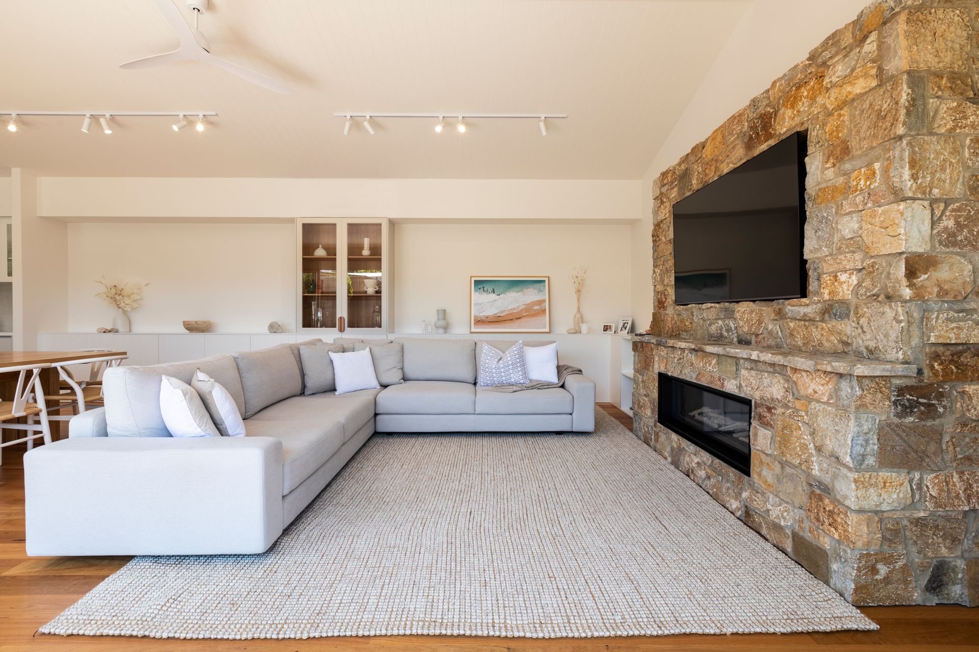 A brick or stone fireplace can be the centrepiece in a Hamptons-style living room. Project: Munday in the Hamptons by Copper &amp; Blake Architecture.